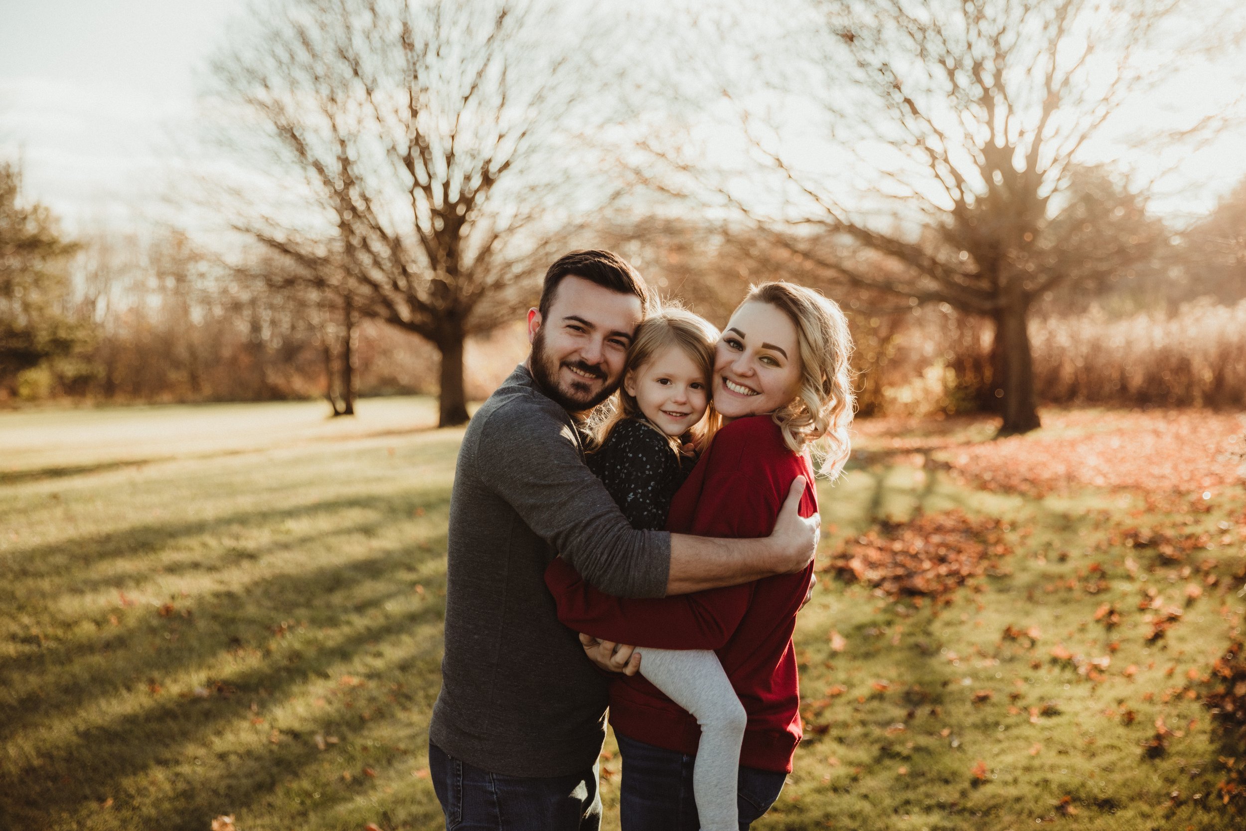 dad_holds_mom_and_daughter_afton_forest_preserve.jpg.jpg