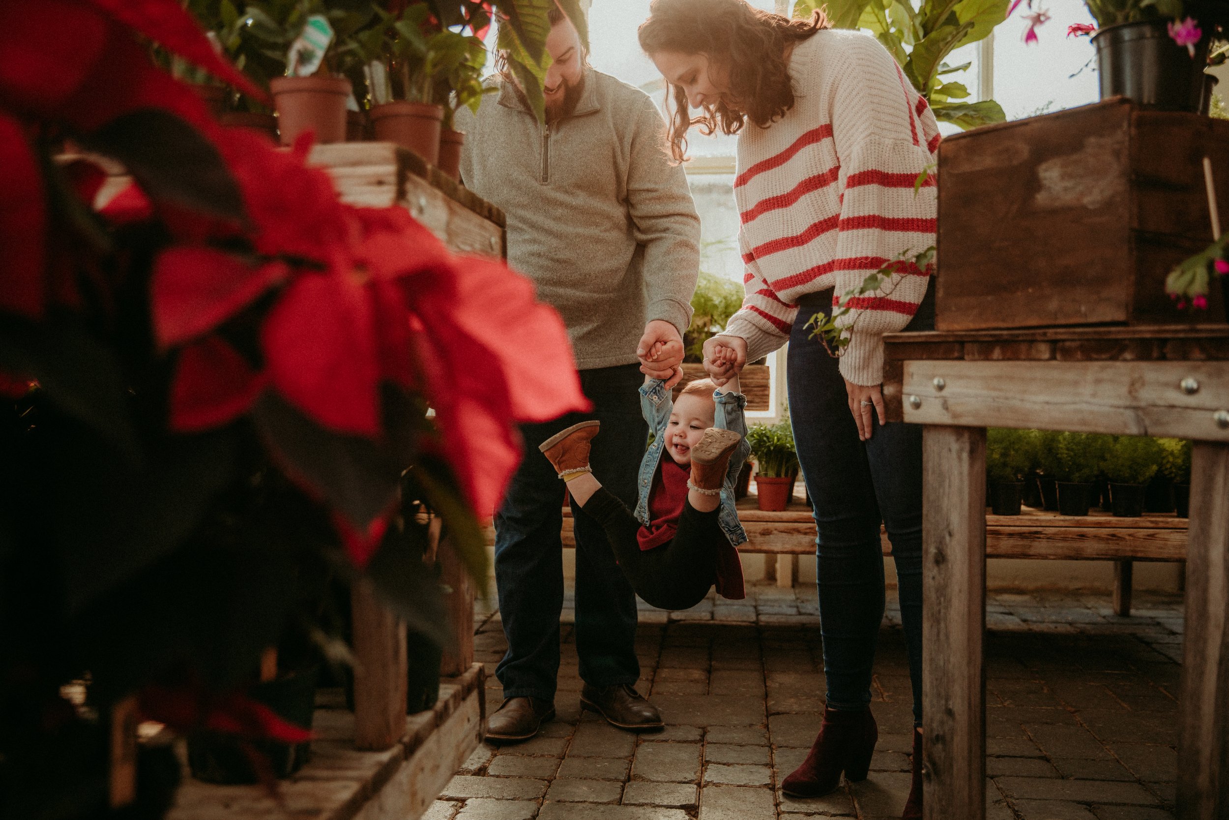 parents_swing_toddler_at_karfre_flowers_greenhouse.jpg.jpg