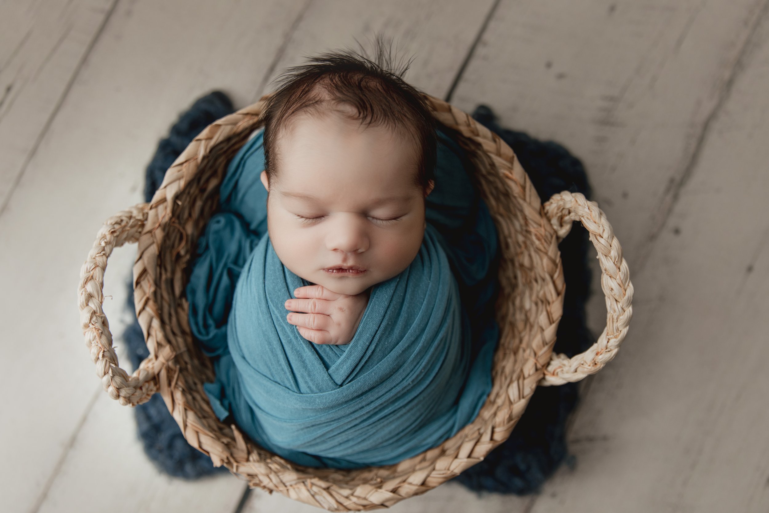newborn_boy_wrapped_in_blue_sleeps_in_basket_sugar_grove.jpg.jpg