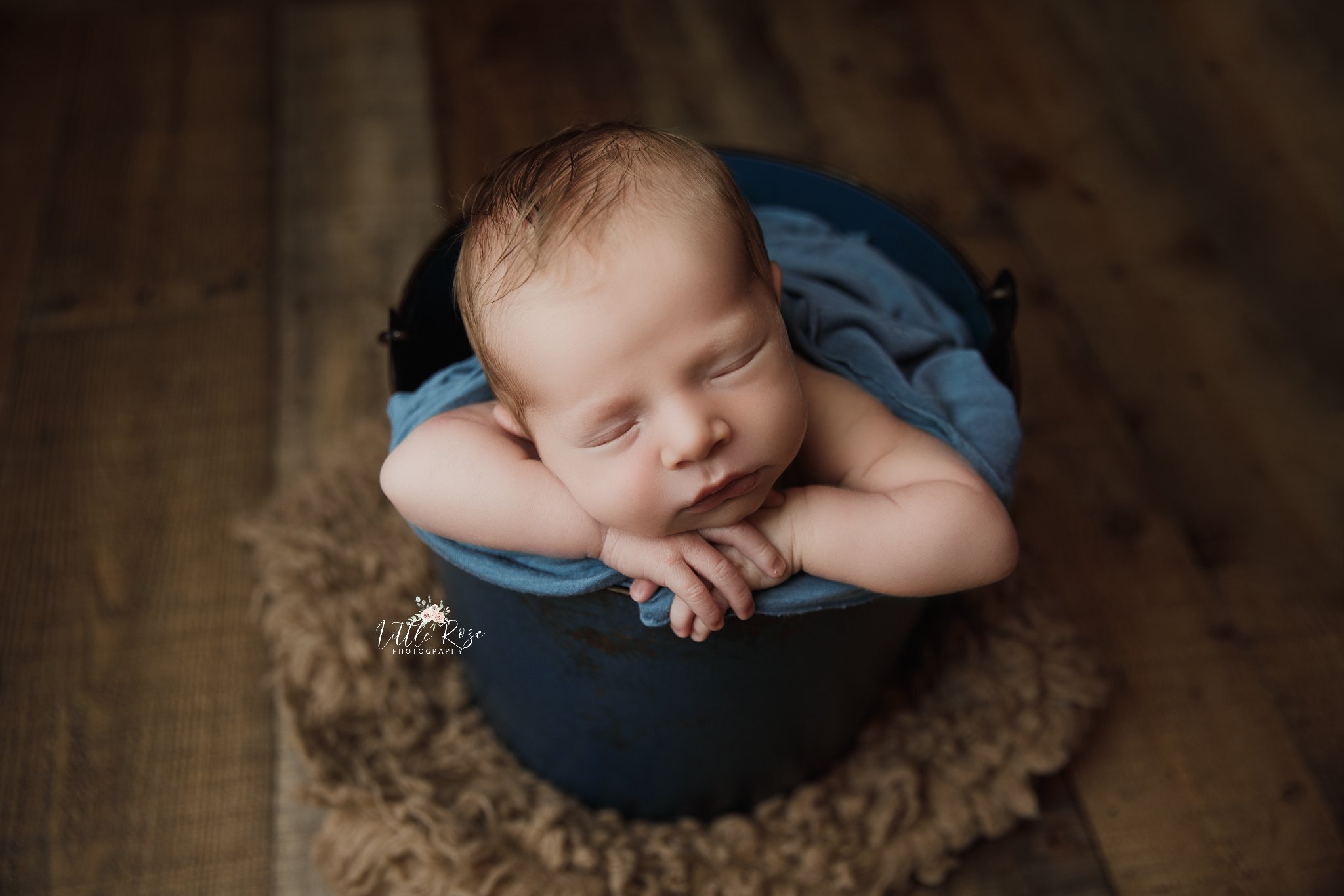 newborn_boy_sleeps_in_blue_bucket.jpg