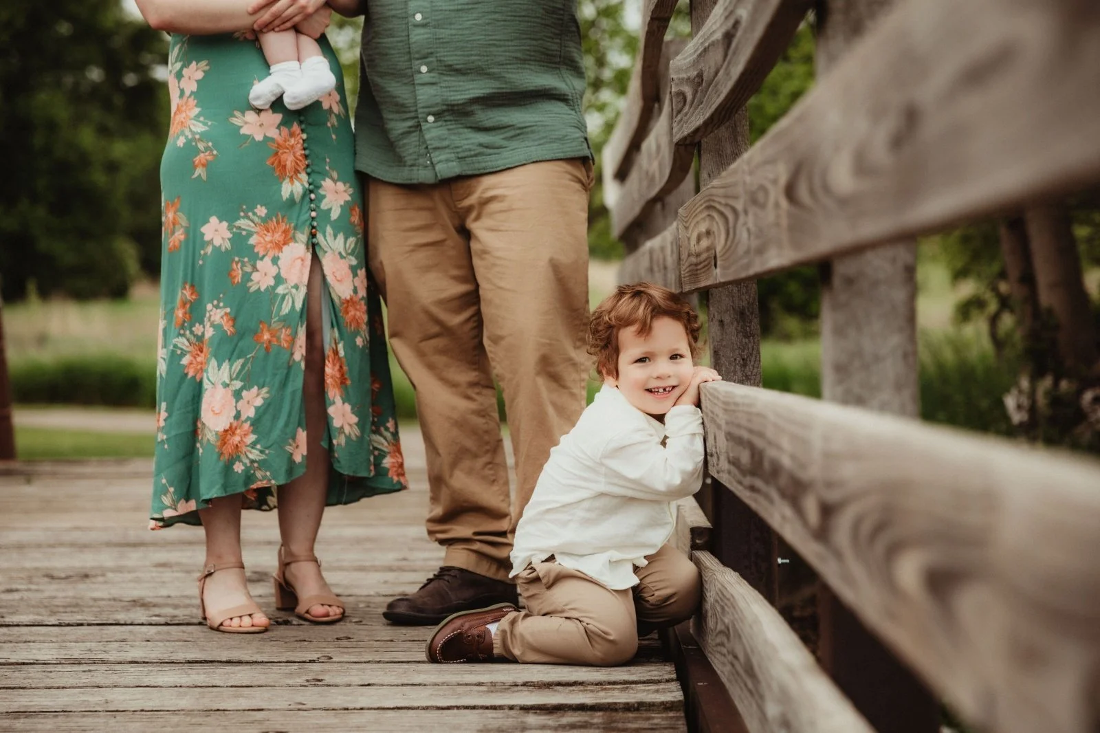 toddler_smiles_on_bridge_afton_forest_preserve