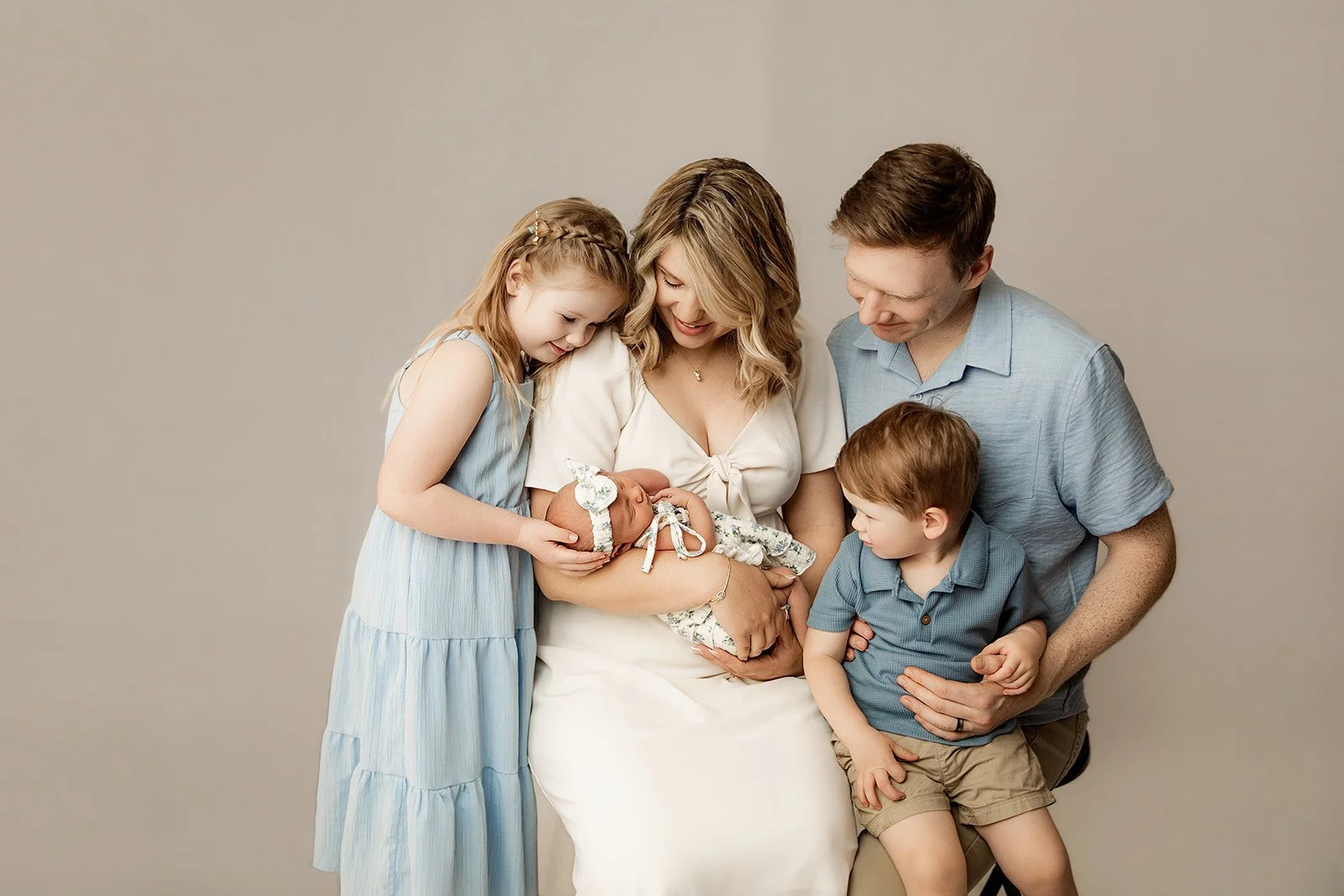 family_admires_newest_baby_girl