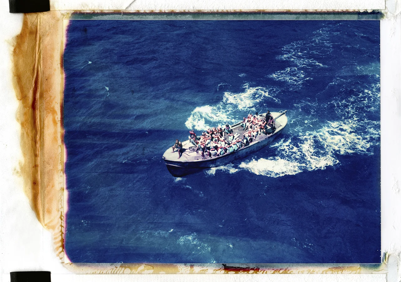 Longboat “Moss”. There is no safe harbour on Pitcairn. Bounty Bay is a tiny inlet, and a trained longboat coxswain must aim the aluminium longboat at the rocks and wait for the swell, turning at the last second to enter the bay. Passing cruise ships rarely land, instead, islanders sell their wares aboard by heading out on the longboat and climbing onto the ship by rope ladder. Here, more than 3/4 of the islanders sit aboard the longboat, Moss, heading out to a cruise ship. If this longboat were to sink, Pitcairn would have been decimated. The longboats are also used to ferry cargo and passengers to and from the Claymore II. In desperate times, the longboats have also been used for medical evacuations to Mangareva, where navigation is conducted solely by compass, and islanders must cross hundreds of miles of open-ocean before landfall. On Pitcairn, the longboats are the island’s lifeline. Without them, the island would be completely cut off. When the men stood trial on Pitcairn, they ferried their own prosecutors to shore in these boats. When the trials first took place, many islanders were worried that prison sentences would kill the island due to the lack of longboat crew. However, once convictions were handed out, they were allowed out of HMP Pitcairn to man the longboat. From Big Fence / Pitcairn Island © Rhiannon Adam