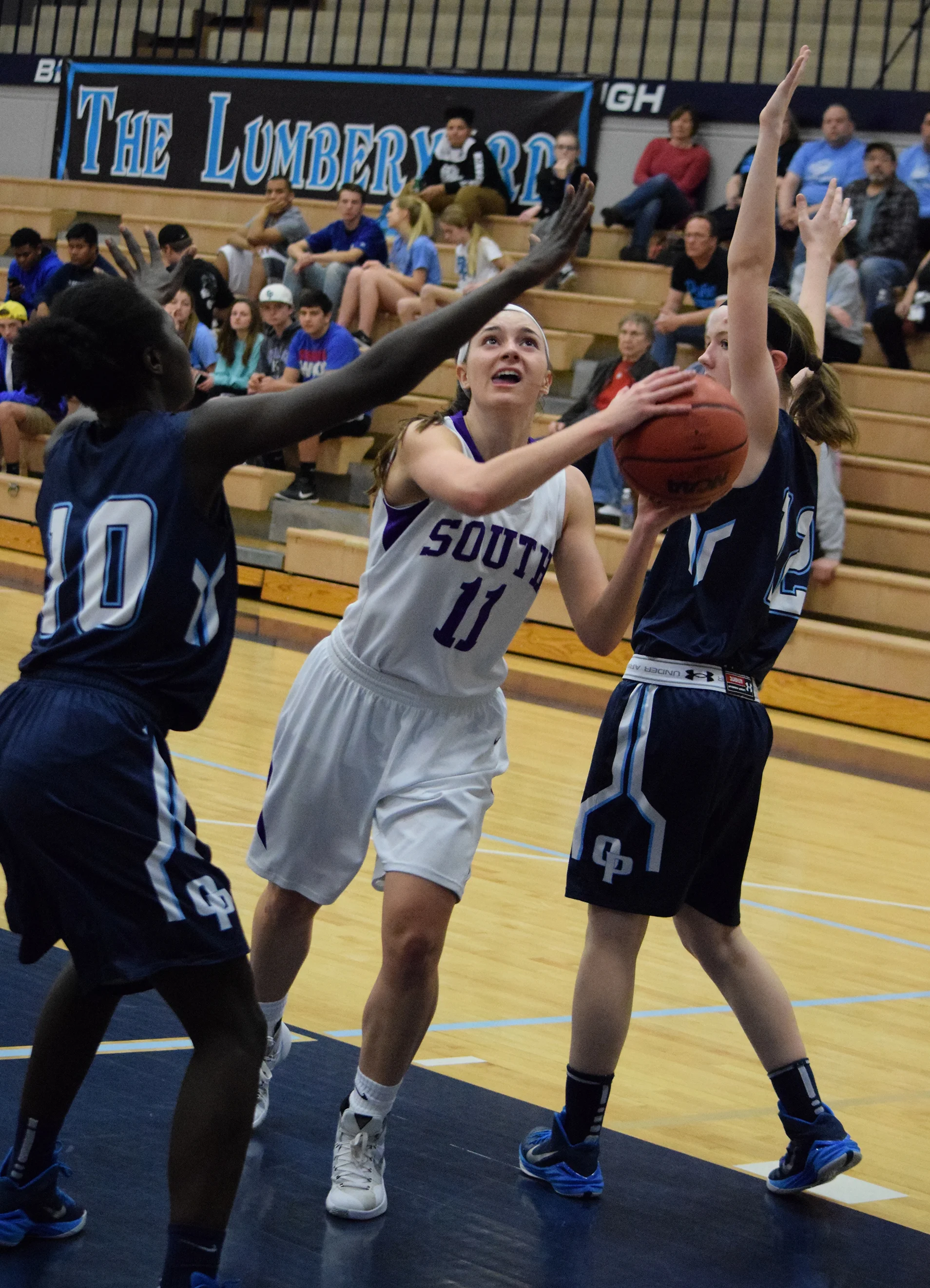BRYCE MERENESS/Citizen photo Park Hill South freshman Alecia Westbrook (25), blocks a shot against Oak Park in the first round of the Class 5 District 16 tournament on Monday, Feb. 29 at Oak Park High School in Kansas City, Mo.