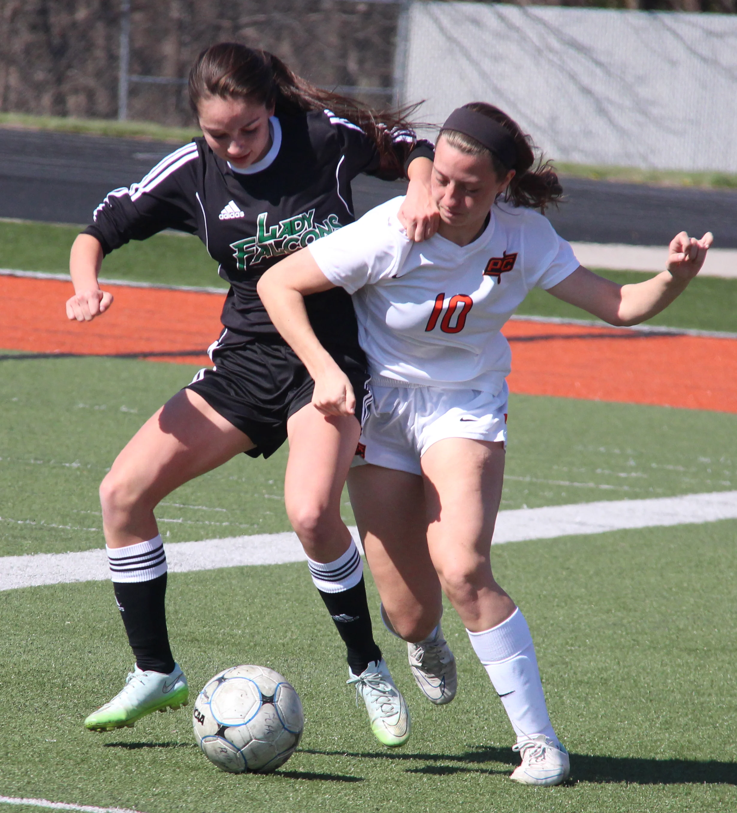ROSS MARTIN/Citizen photo Platte County’s Calle Boe attempts to hold off a Staley player in the Pirates 3-2 loss during a Platte County Invitational match on Monday, March 21.