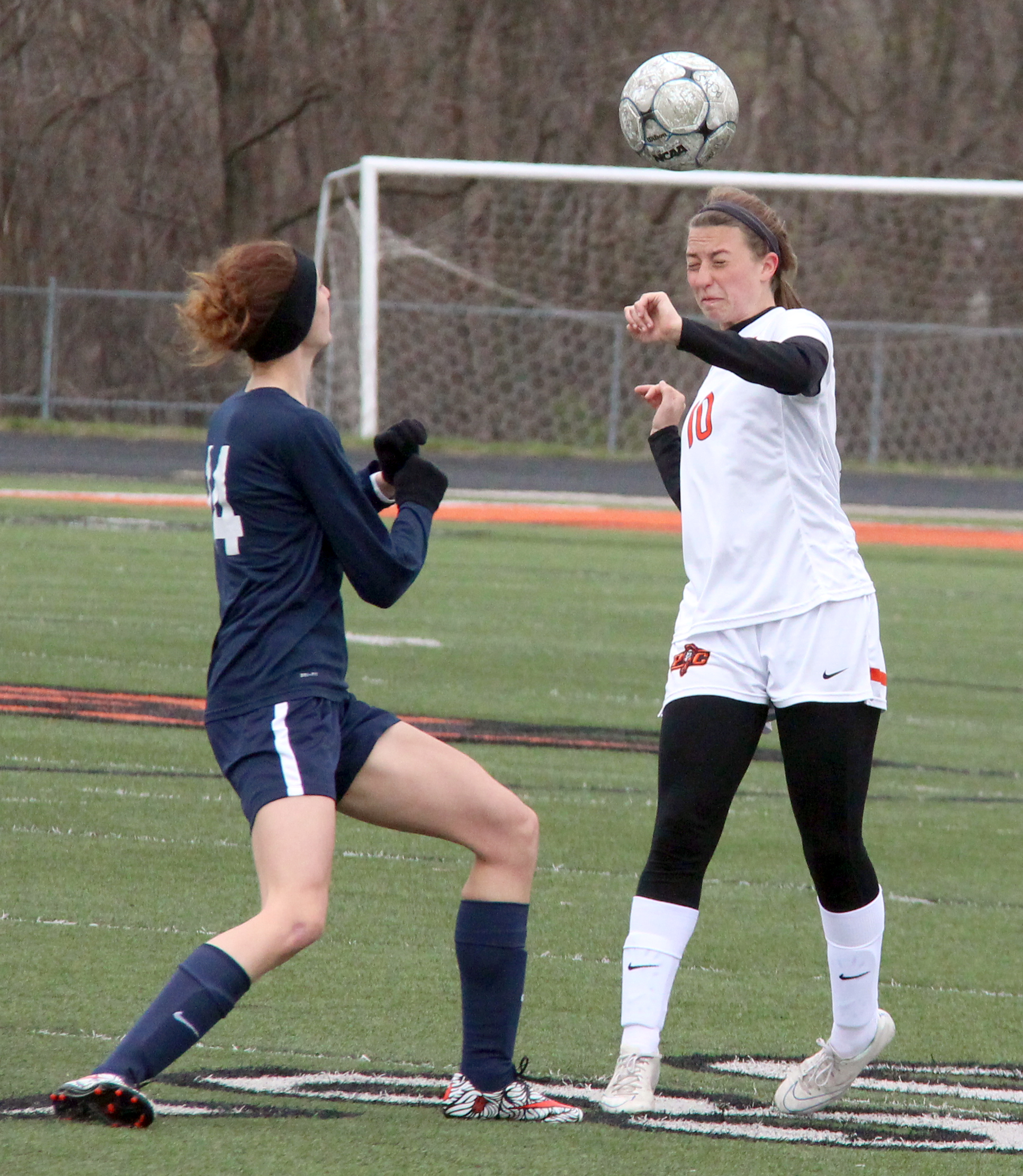 ROSS MARTIN/Citizen photos Platte County junior defender Calle Boe, right, heads a clearance during the Platte County Invitational championship match against Liberty North on Thursday, March 24 at Pirate Stadium.