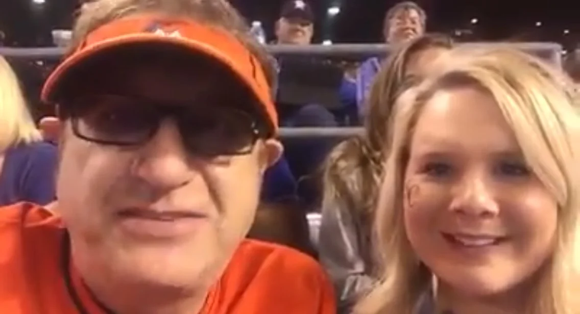 Facebook.com On Opening Day at Kauffman Stadium, Laurence Leavy (left), a Miami-based lawyer known as Marlins Man for the distinctive orange baseball jersey he wears while attending high-profile sporting events, recorded a video message for Landon with Kayla Parker (right). The Jaros family has received dozens of videos since Landon’s diagnosis, playing them for him during his current stay at Children’s Mercy Hospital.