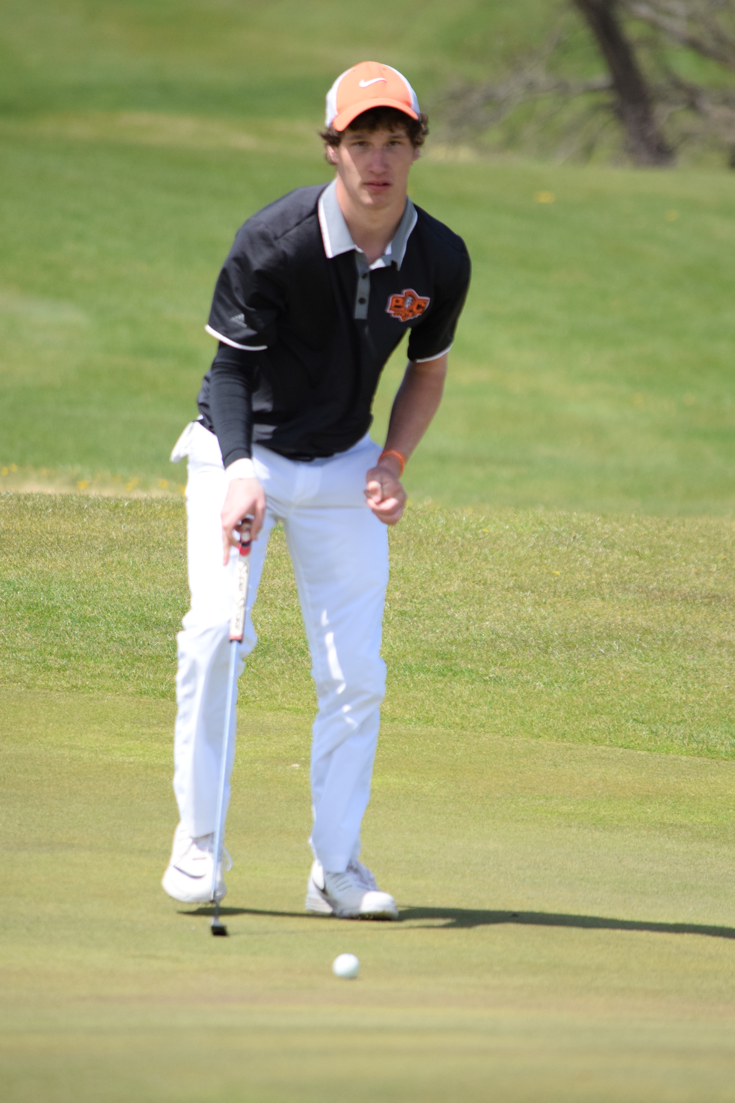 BRYCE MERENESS/Citizen photo Platte County senior Matt Madill eyes a putt during the Northland Invitational held Monday, April 11 on the Posse Course at Paradise Pointe Golf Complex in Smithville, Mo.
