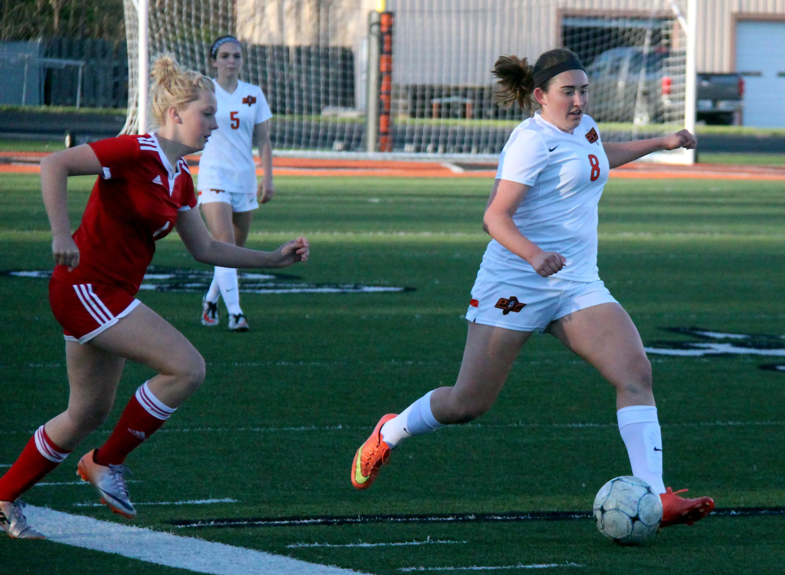 ROSS MARTIN/Citizen photo Platte County senior defender Haley Valentine, right, dribbles away from a Cardinals defender. Valentine is the lone starter on the backllne who played that position last season.