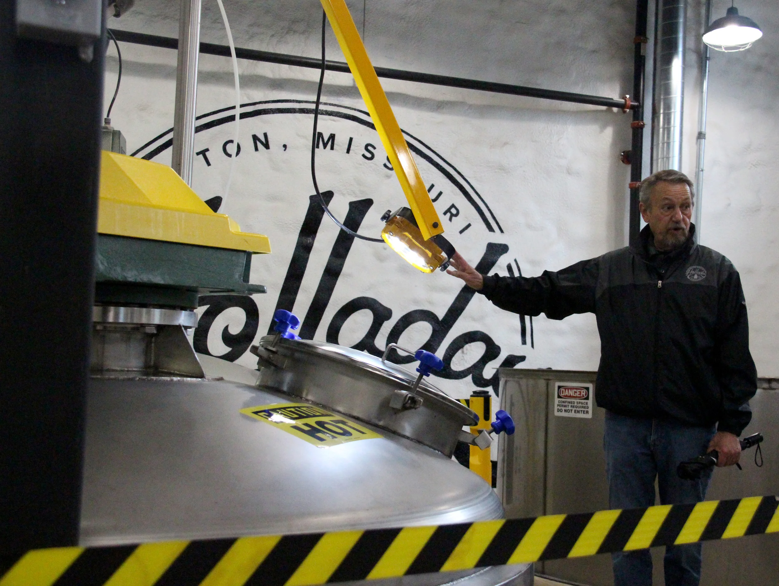 ROSS MARTIN/Citizen photo Tour guide Jim Stevens describes the process of cooking mash for Holladay Distillery during a tour at the facility Friday, May 13 in Weston, Mo. McCormick Distillery recently restarted distilling on site and giving tours after a 25-year hiatus.