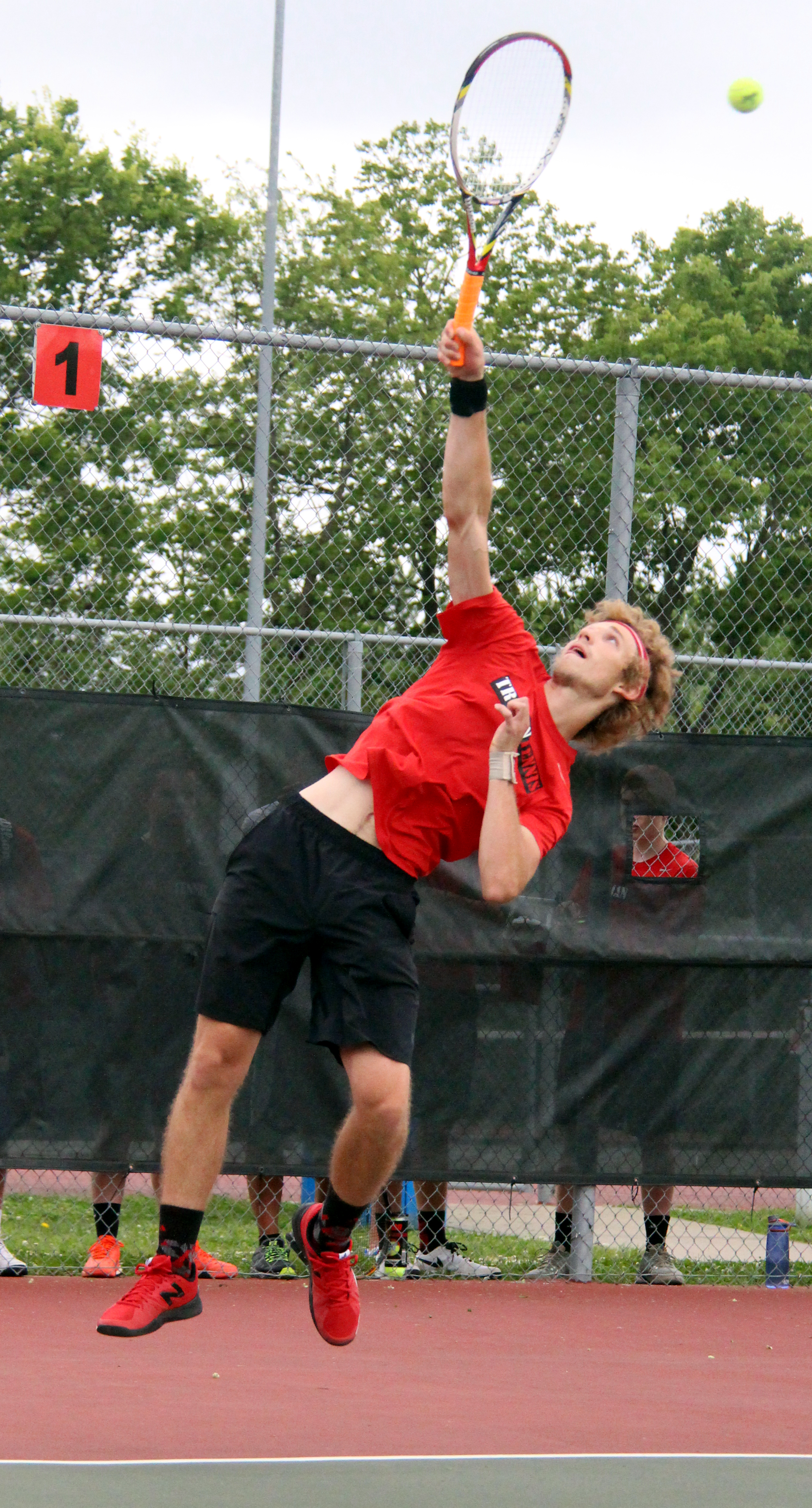 ROSS MARTIN/Citizen photo Park Hill's Henry Eckold hits a serve during a doubles match in the Class 2 District 15 dual championship against Park Hill South on Wednesday, May 11 at Barry Park in Kansas City, Mo.