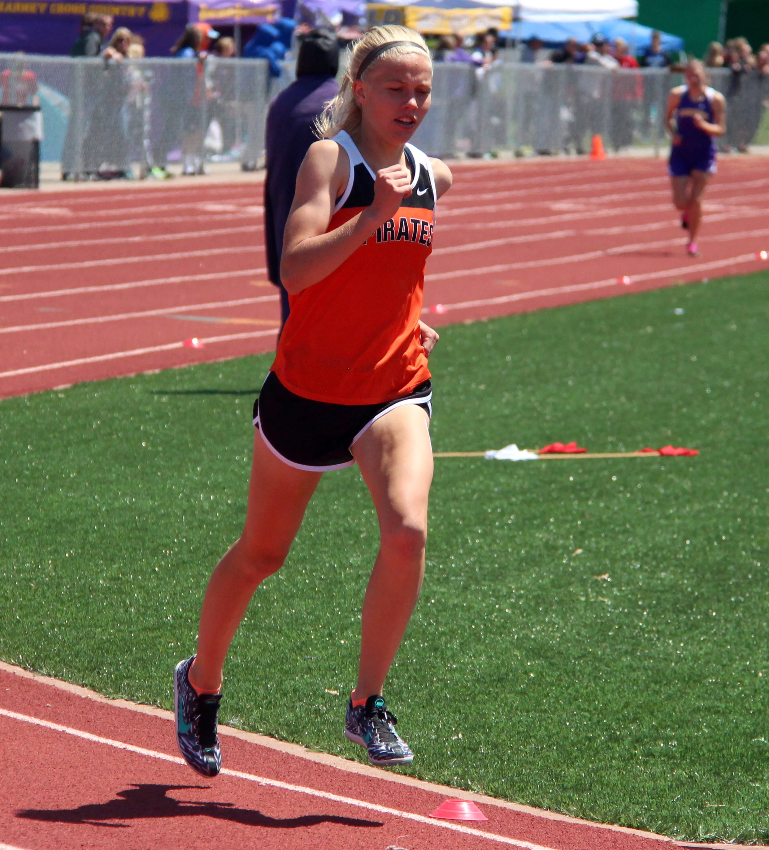 ROSS MARTIN/Citizen photo Platte County sophomore Rebekah Geddes, left, leads second-place Anne Wood of Kearney, right, on the third lap of the 1,600-meter run during the Class 4 District 8 meet Saturday, May 14 at Excelsior Springs High School in Excelsior Springs, Mo.