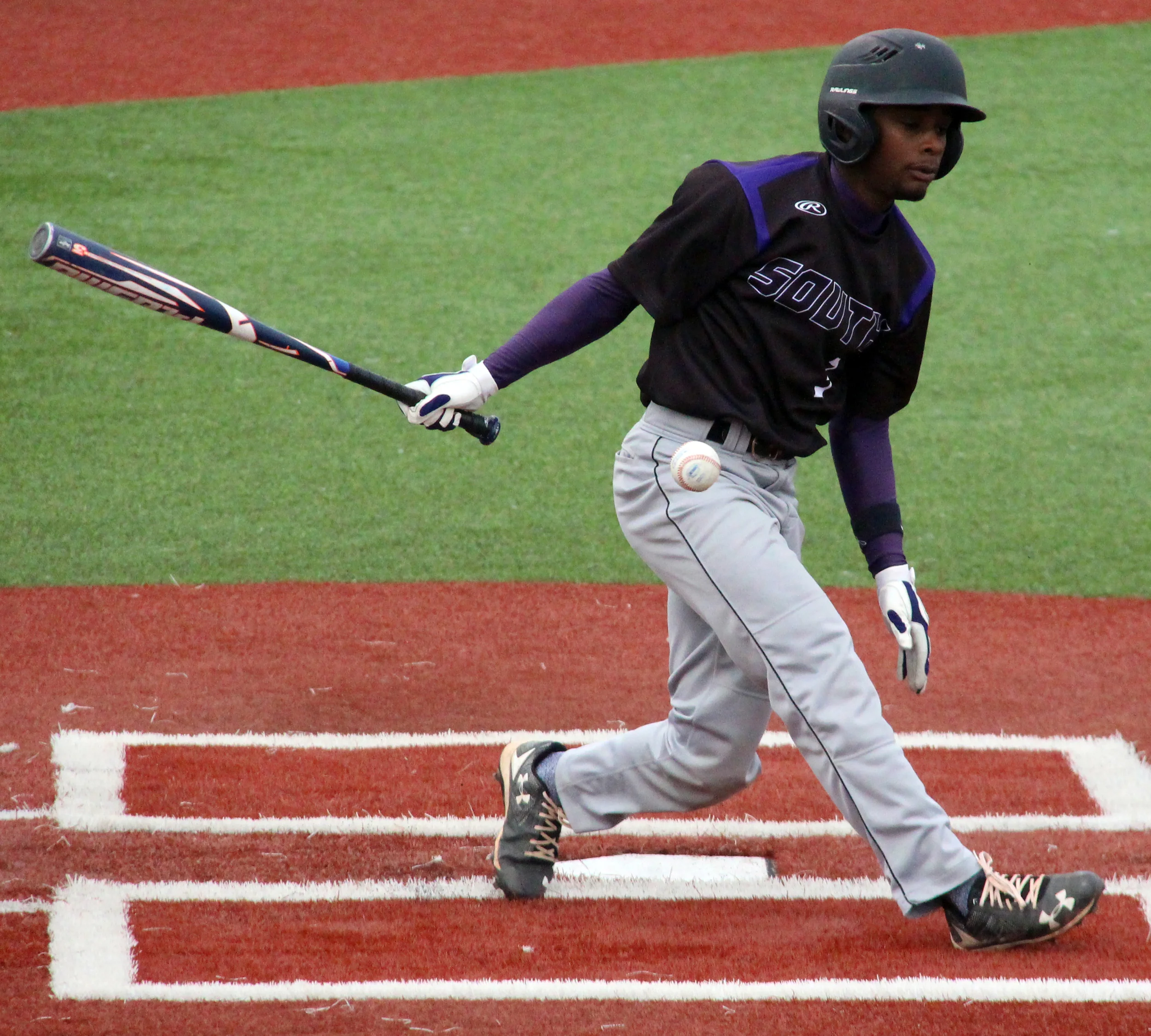 ROSS MARTIN/Citizen photo Park Hill South designated hitter Malik Stevenson hits a foul ball during the Class 5 District 16 championship game Friday, May 20 at Griffon Spring Sports Complex in St. Joseph, Mo.