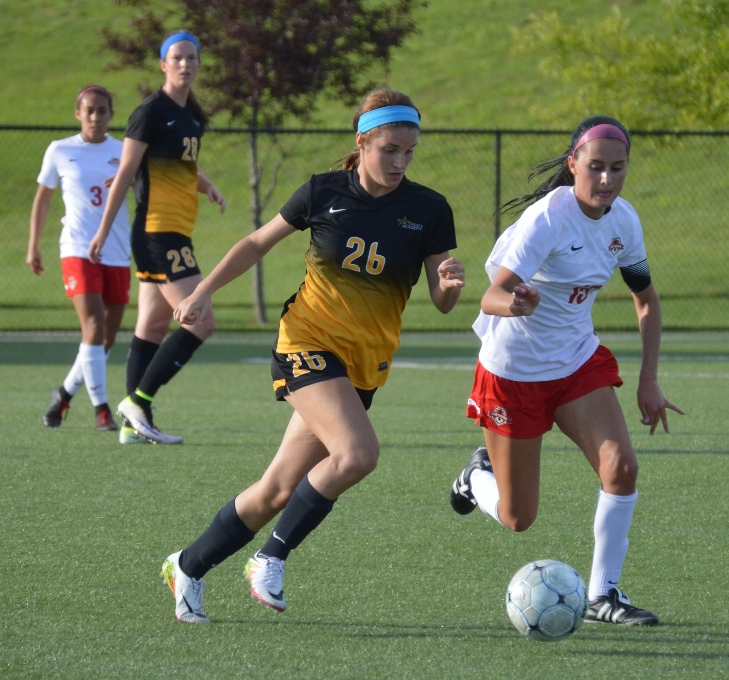 BRENT ROSENAUER/Citizen photo Park Hill senior Taylor Buckholz, right, fights with St. Teresa’s junior Kate Scofield for possession. 
