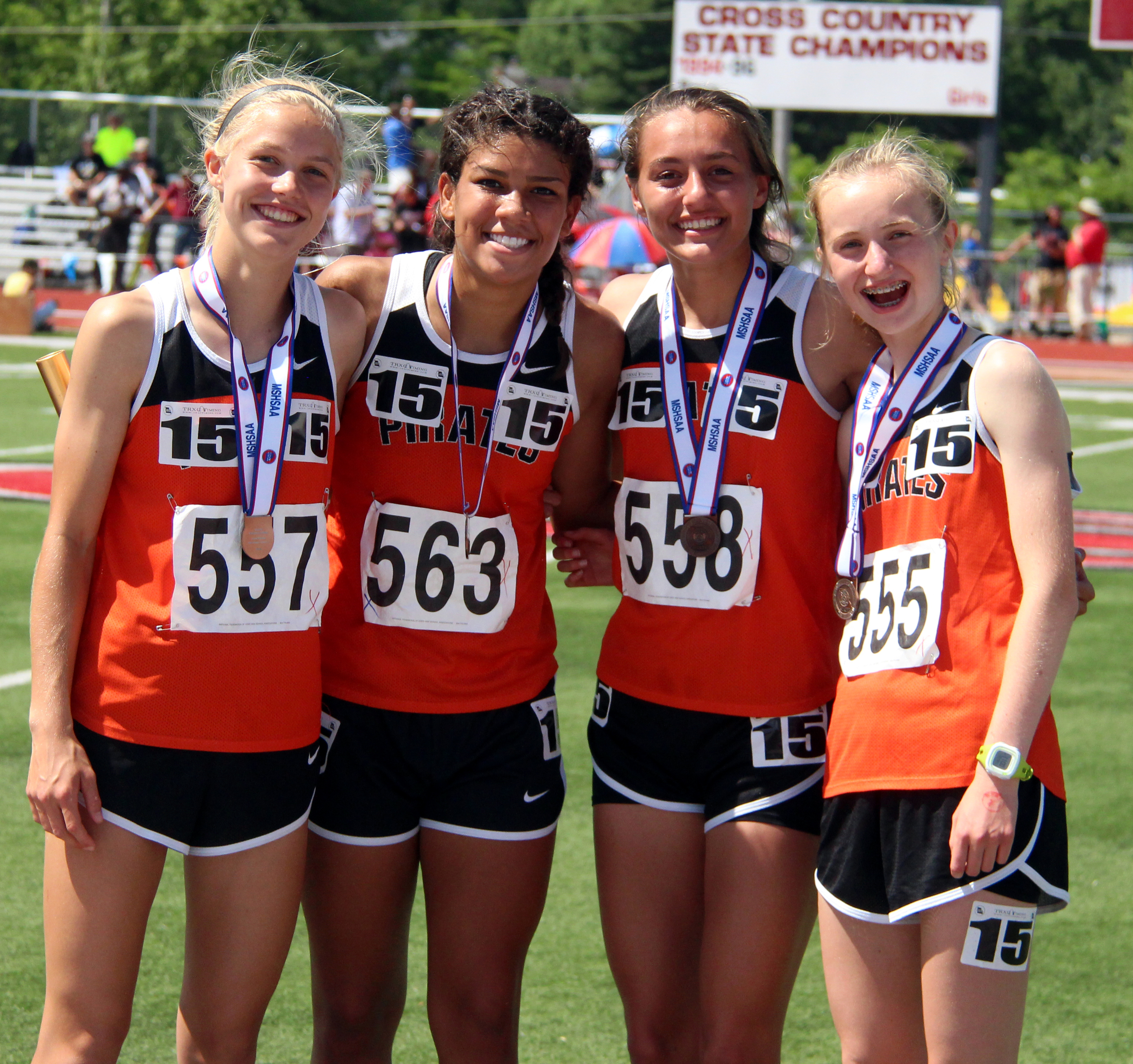 ROSS MARTIN/Citizen photo Members of Platte County’s 4x800-meter relay team (from left) Rebekah Geddes, Ava White, Rachel Gilbert and Jessica Clark smile on the podium with their sixth-place medals Saturday, May 28 during the Class 4 Missouri State Track and Field Championships in Jefferson City, Mo.