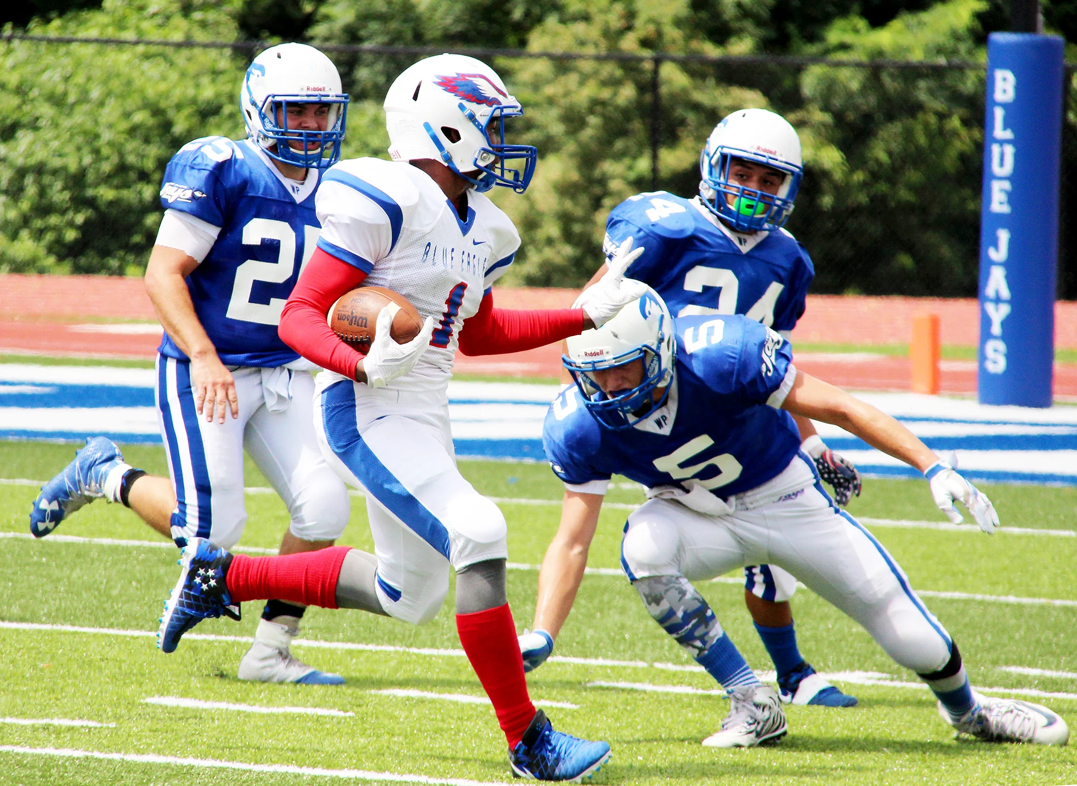 ROSS MARTIN/Citizen photo West Platte defensive back Grant Eagen (5) tries to tackle Central Academy of Excellence quarterback Javion Shelby during a game Saturday, Aug. 20 at the new Rudolph Eskridge Stadium in Weston, Mo.