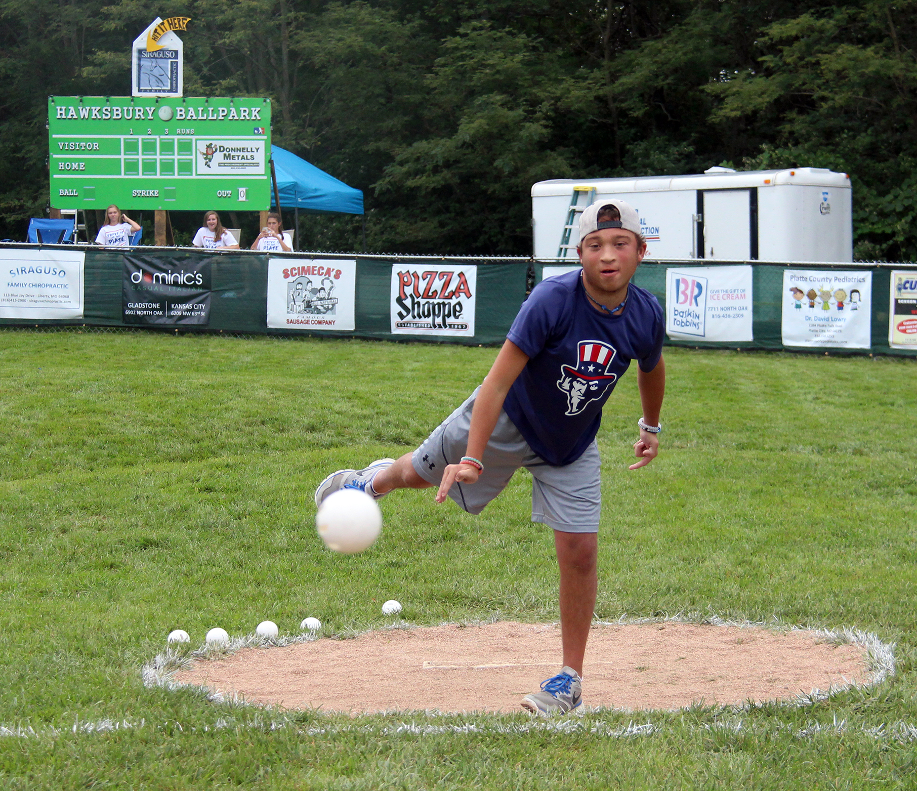 ROSS MARTIN/Citizen photo Phillip Scimeca throws out the ceremonial first pitch for the sixth annual Phillip Scimeca Wiffle Ball Classic, held Sunday, Sept. 4 in his neighborhood in Kansas City, Mo.