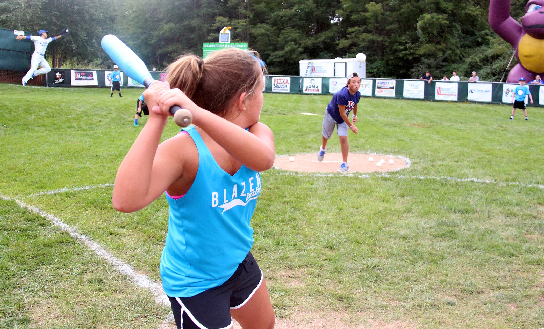 ROSS MARTIN/Citizen photos Phillip Scimeca pitches to sister Ella Scimeca during the sixth annual Phillip Scimeca Wiffle Ball Classic, held Sunday, Sept. 4 in their neighborhood in Kansas City, Mo.