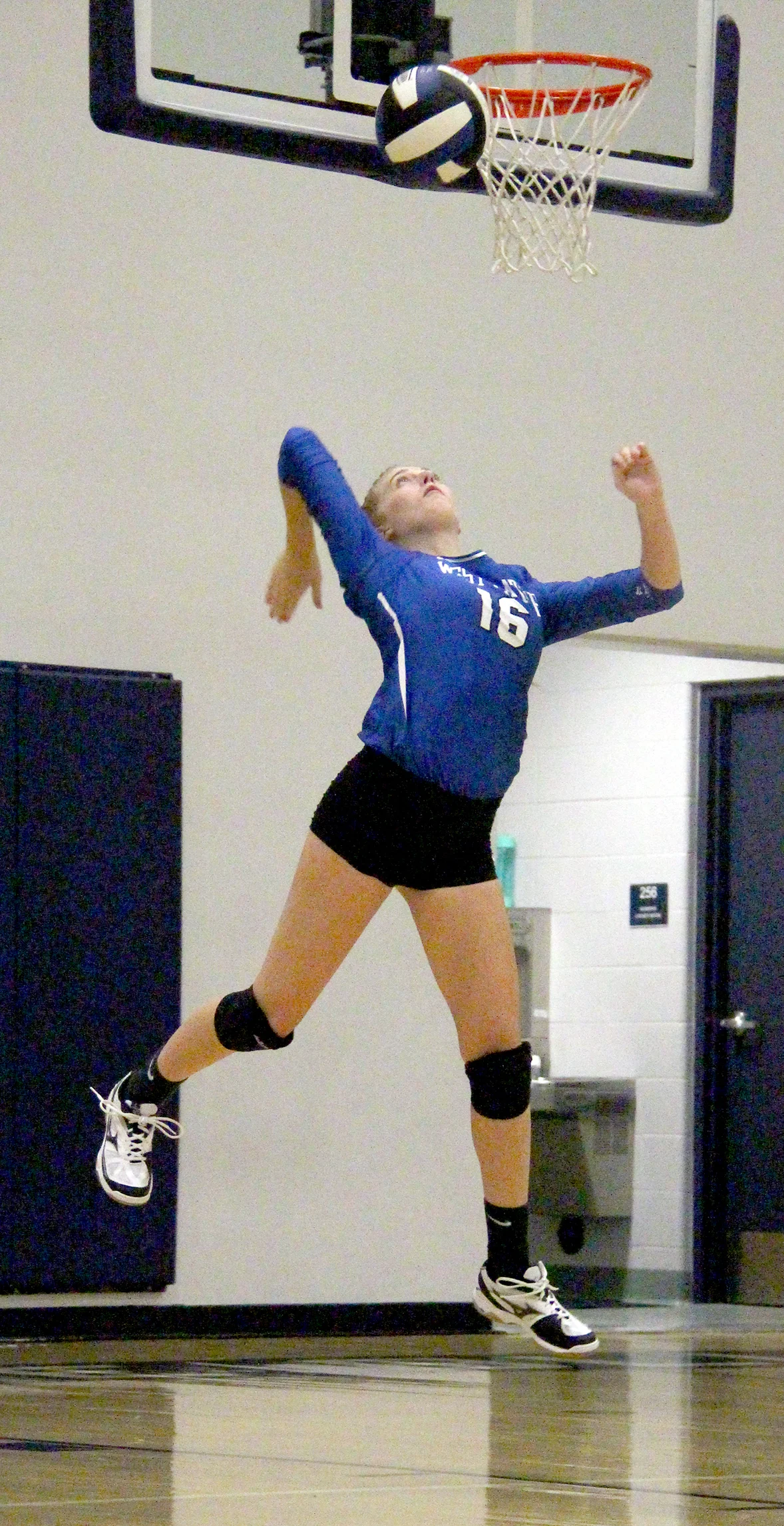 ROSS MARTIN/Citizen photo West Platte senior setter Megan Kottman hits a serve during the Bluejays’ 2-1 win against East Buchanan on Thursday, Sept. 1 at West Platte High School in Weston, Mo.