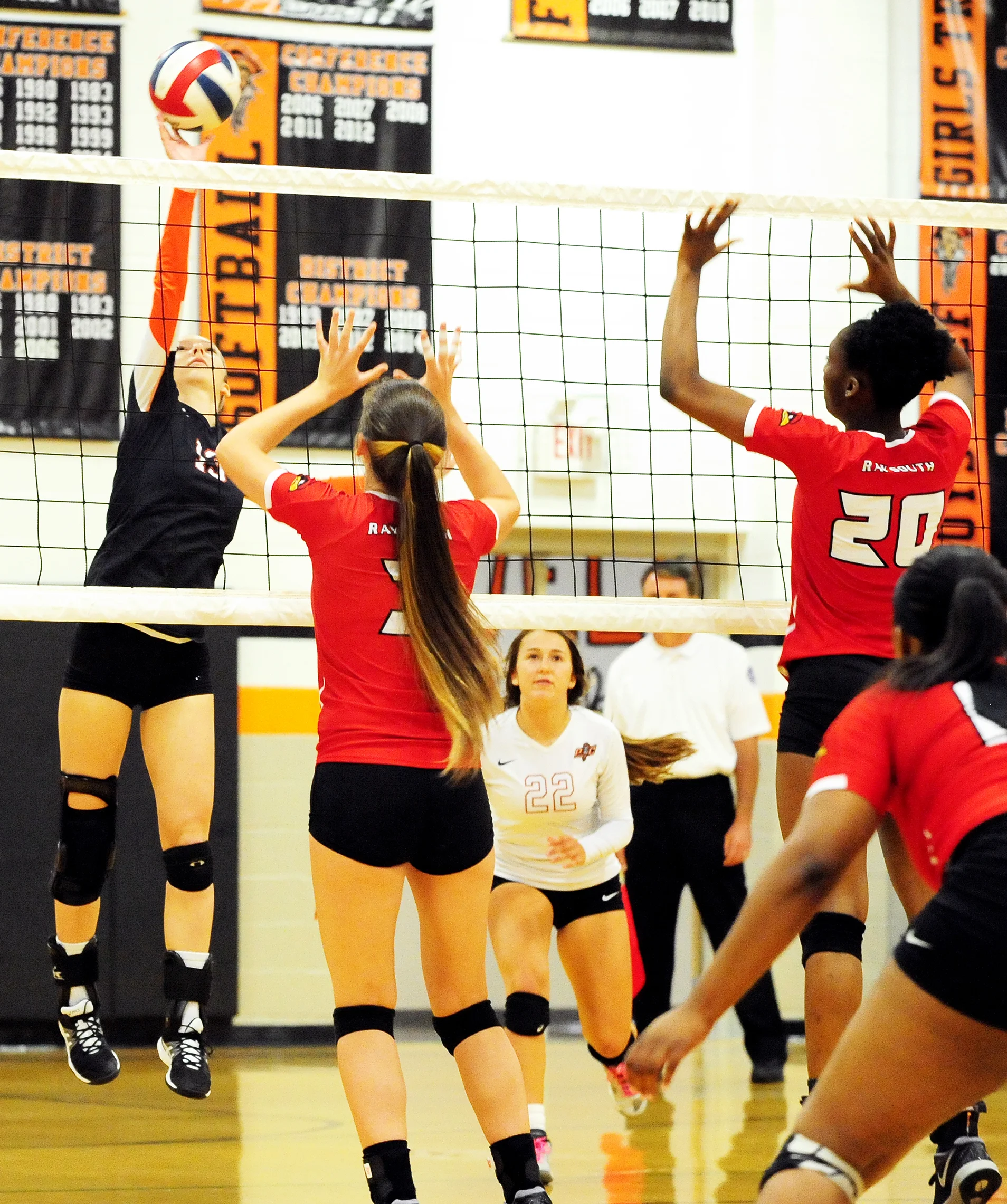 NICK INGRAM/Citizen photo Platte County senior Hannah Kunels, left, hits a spike against Raytown South on Thursday, Sept. 22 at Platte County High School.