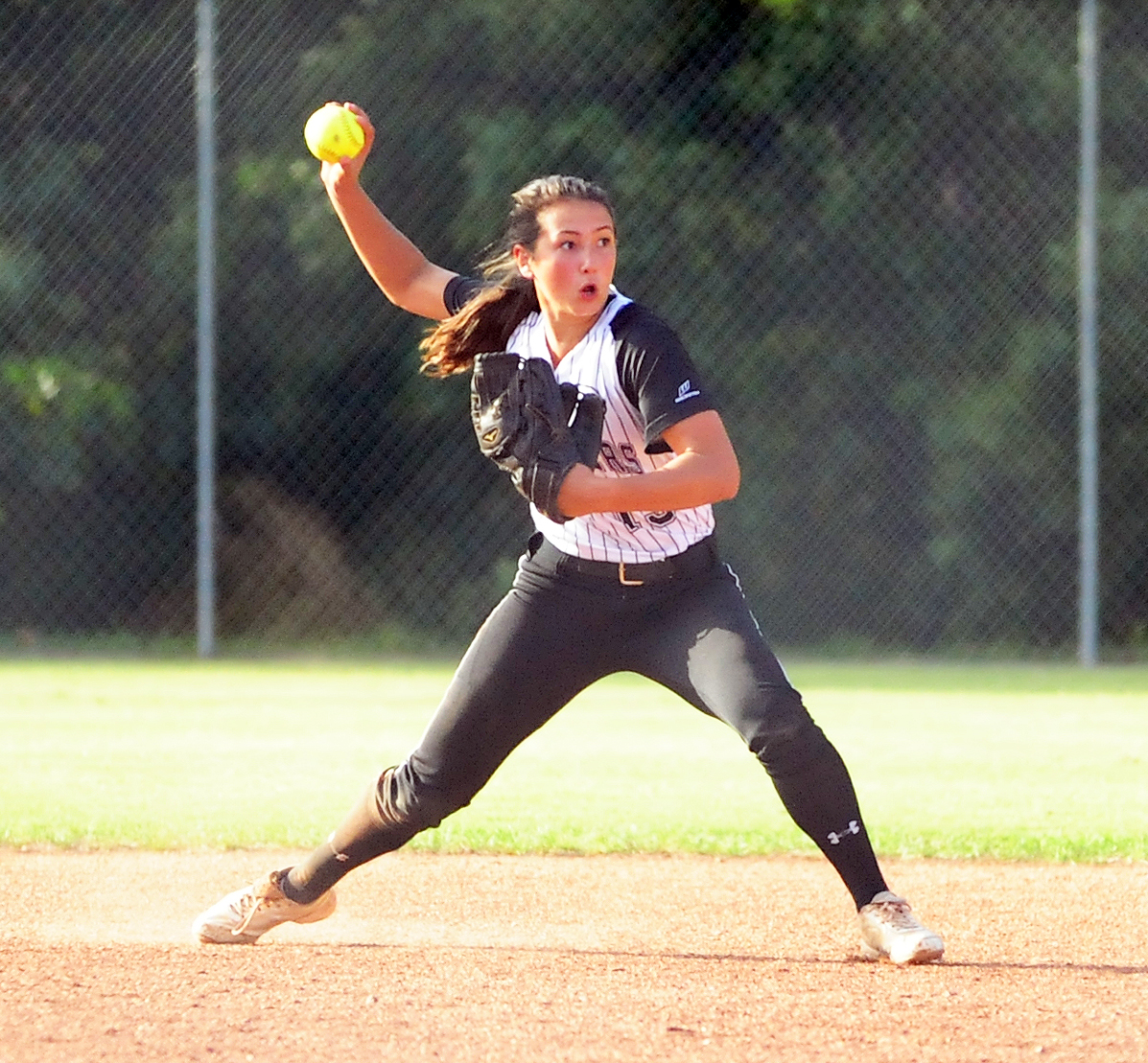NICK INGRAM/Citizen photo Park Hill South sophomore Kate Kobayashi throws to first in a game against Park Hill on Monday, Oct. 3 at Park Hill South High School in Riverside, Mo. 
