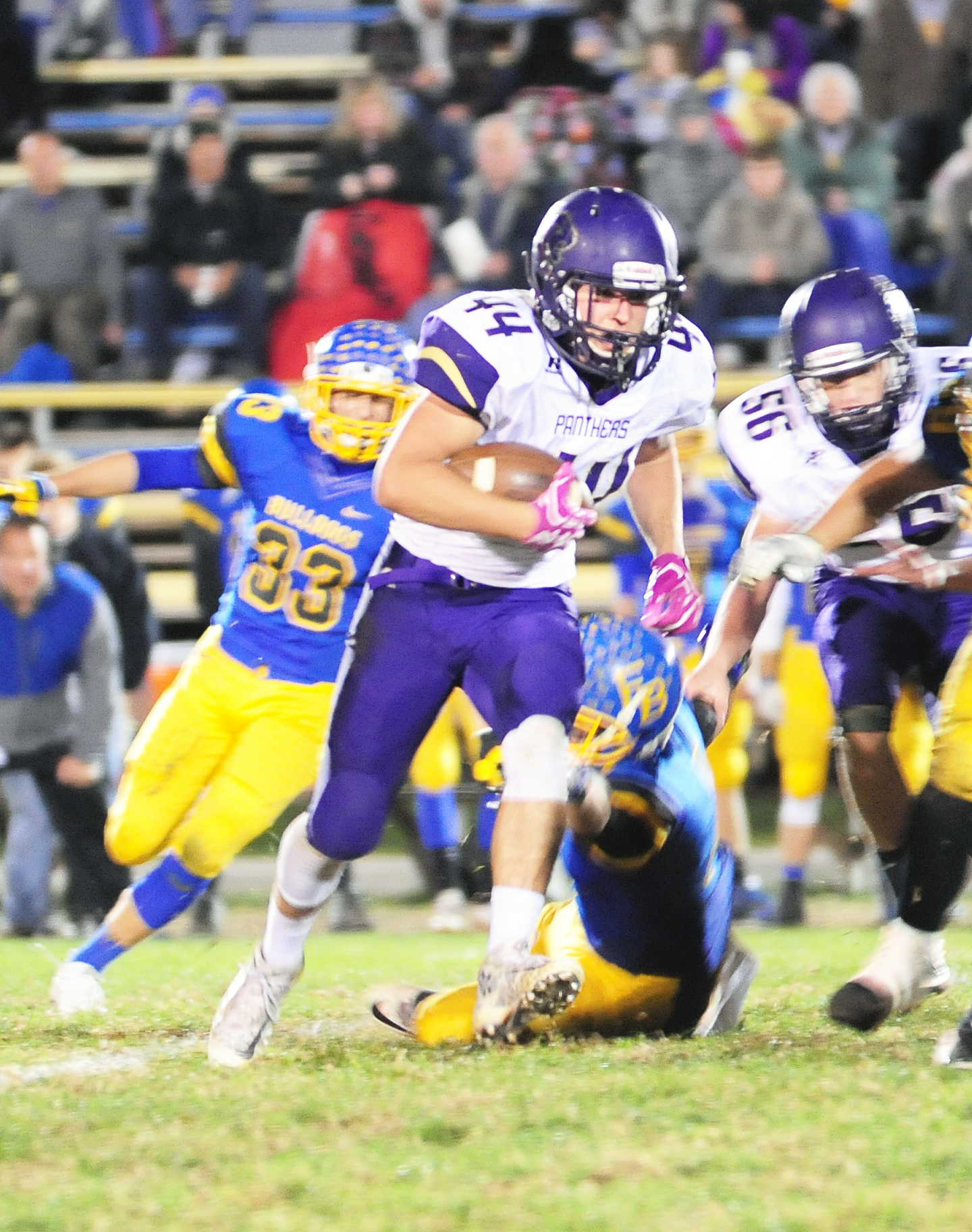 NICK INGRAM/Citizen photo North Platte senior running back Parker Rotterman breaks into the open field on a run against East Buchanan on Friday, Oct. 21. BOTTOM RIGHT: French looks to throw a pass between a pair of blockers.