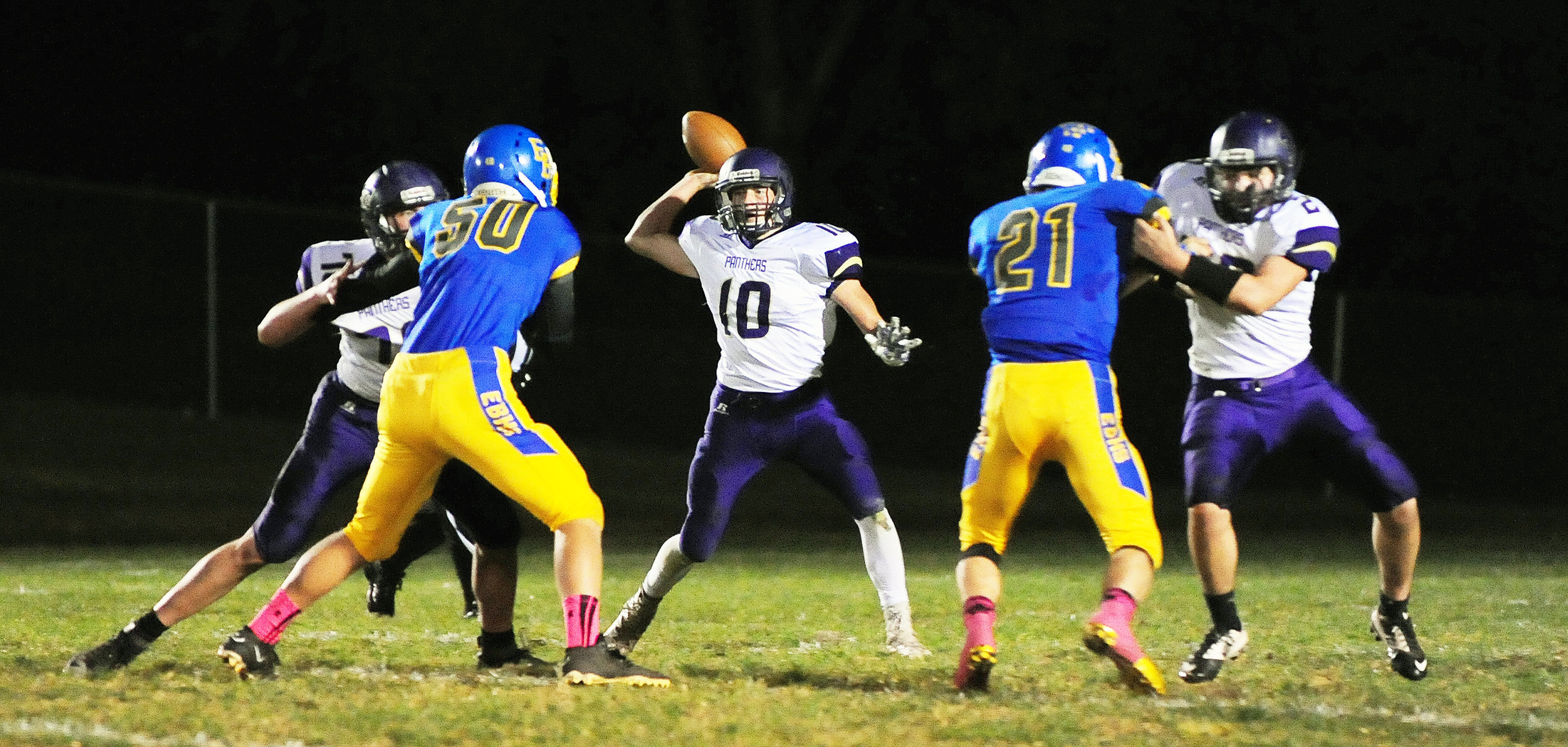 NICK INGRAM/Citizen photo North Platte senior Ben French looks to throw a pass between a pair of blockers against East Buchanan.