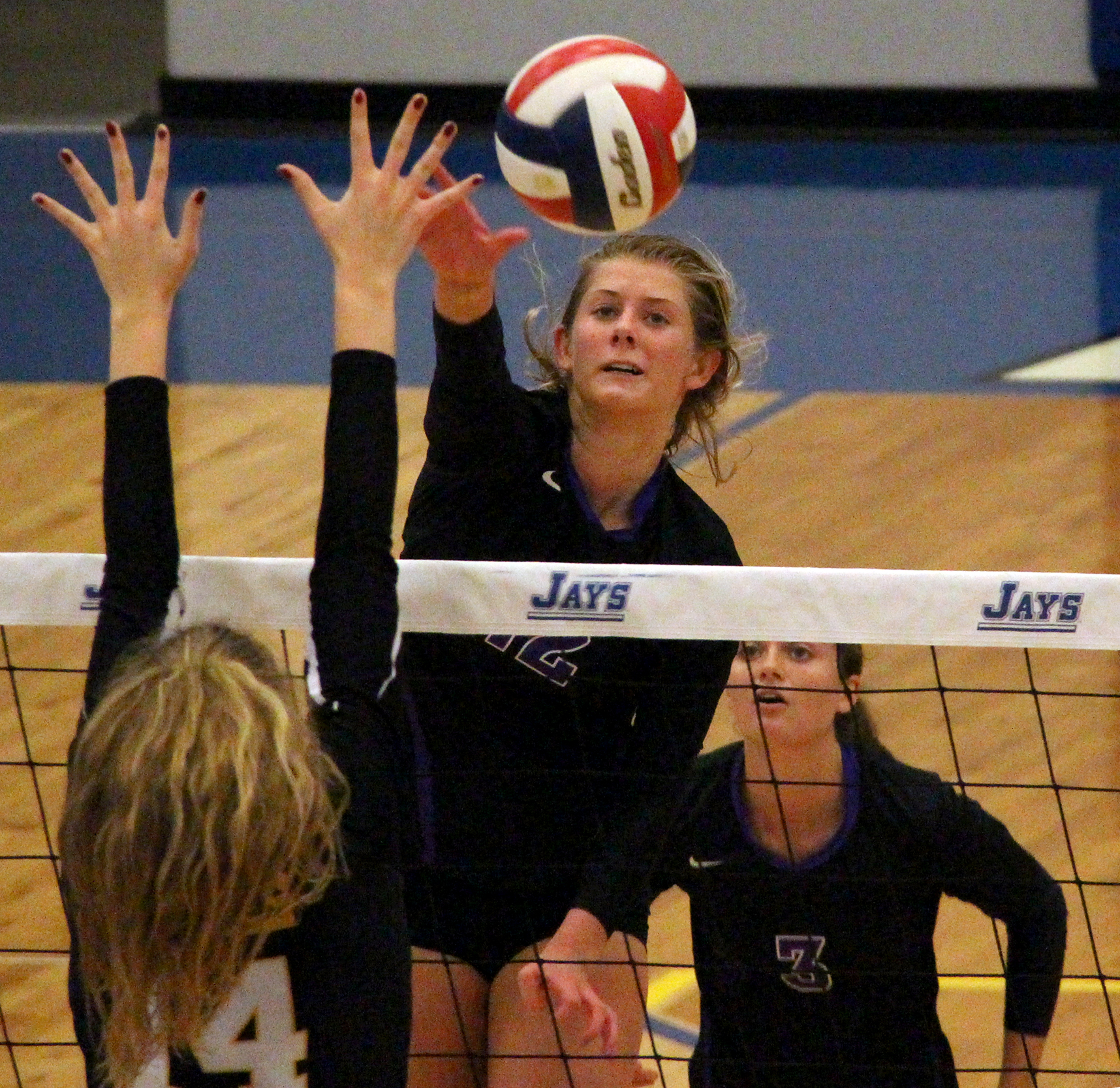 ROSS MARTIN/Citizen photo Park Hill South senior Andi Elley (12) hits a spike over the net against St. Teresa’s Academy in a Class 4 quarterfinal played Saturday, Oct. 22 at Liberty Fieldhouse in Liberty, Mo.