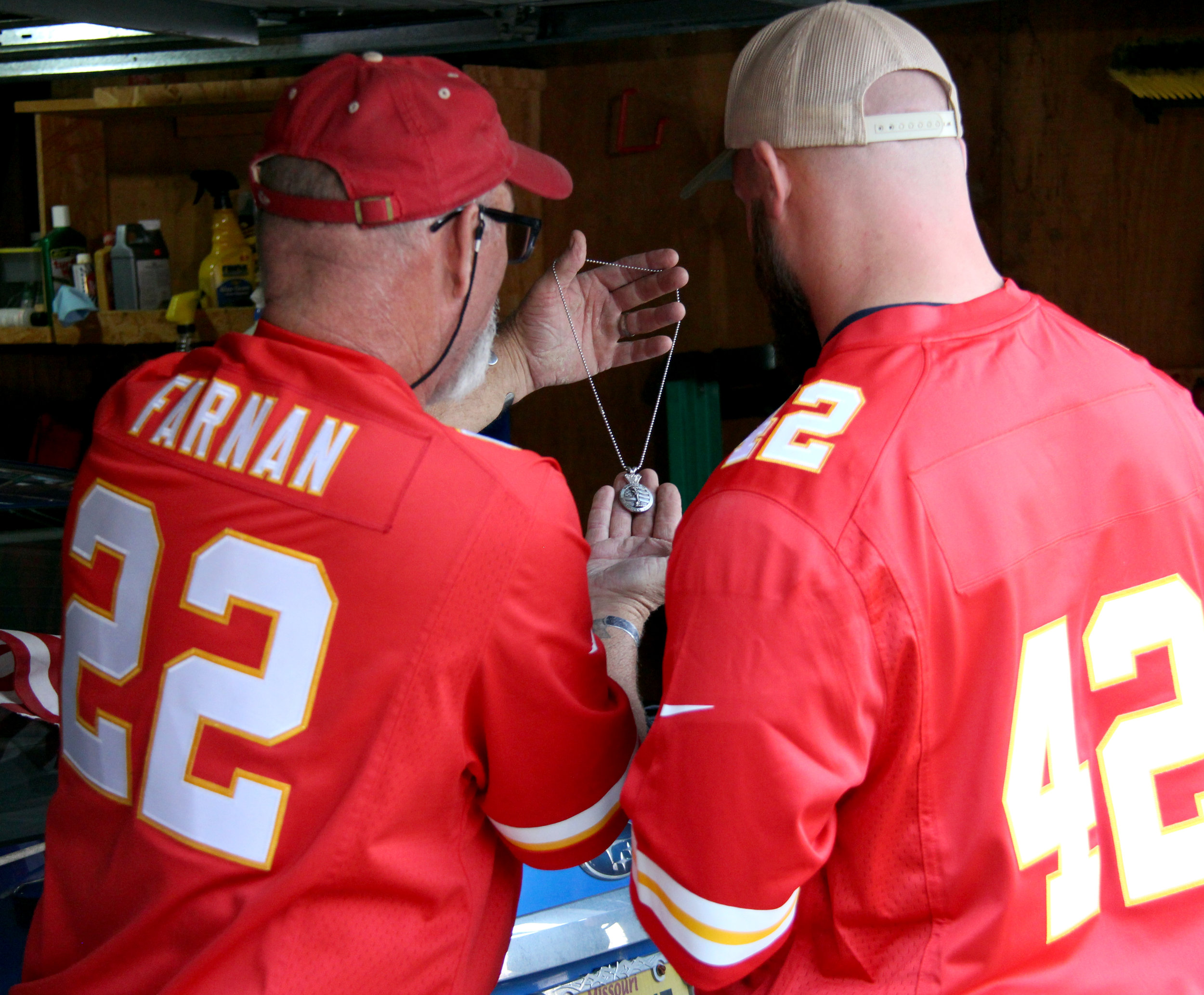 ROSS MARTIN/Citizen photo Patrick Farnan, left, gives a special Gold Star medallion to Kansas City Chiefs fullback Anthony Sherman during his visit Monday, Nov. 7 in Weston, Mo. 