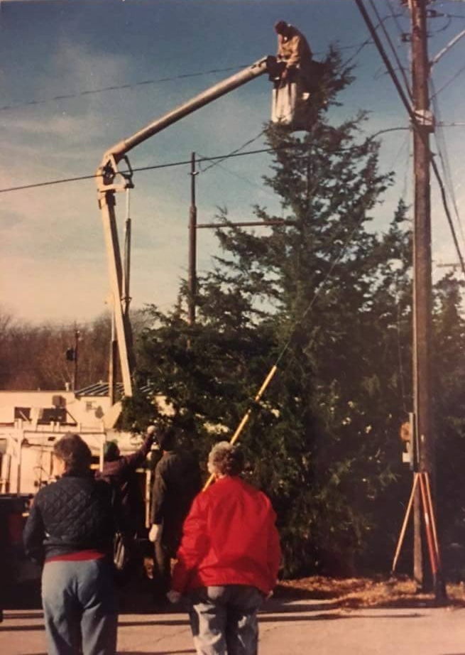 Contributed photo Crews work to set up the Mayor’s Christmas Tree for the annual Christmas in Dearborn celebration in this 2001 file photo. Members of the community have revived the tradition for this year. 