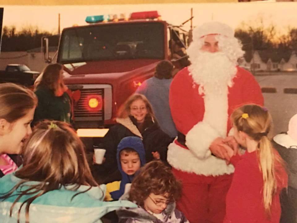 Contributed photo Santa Claus comes down off of a Dearborn Area Fire Protection District truck to greet children during the 2001 Christmas in Dearborn celebration in Dearborn, Mo. The once annual event went away in recent years but will be revived this weekend. 