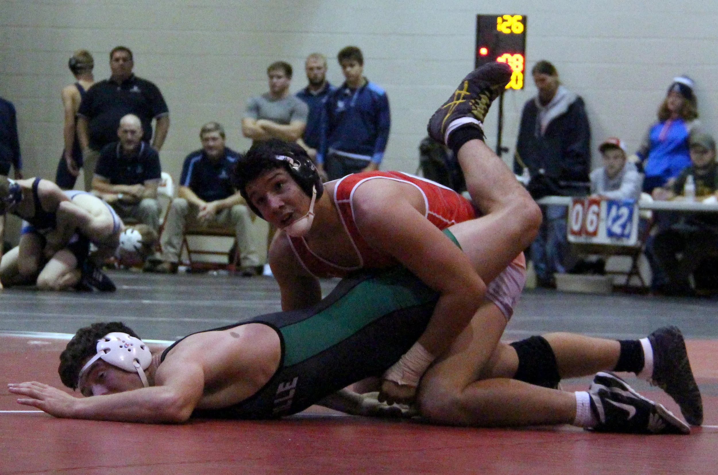 ROSS MARTIN/Citizen photo Park Hill freshman Ashton Sharp, top, looks up at the clock while wrestling Smithville’s Jacob Boyd during the Park Hill Duals tournament held Saturday, Dec. 3 at Park Hill High School.
