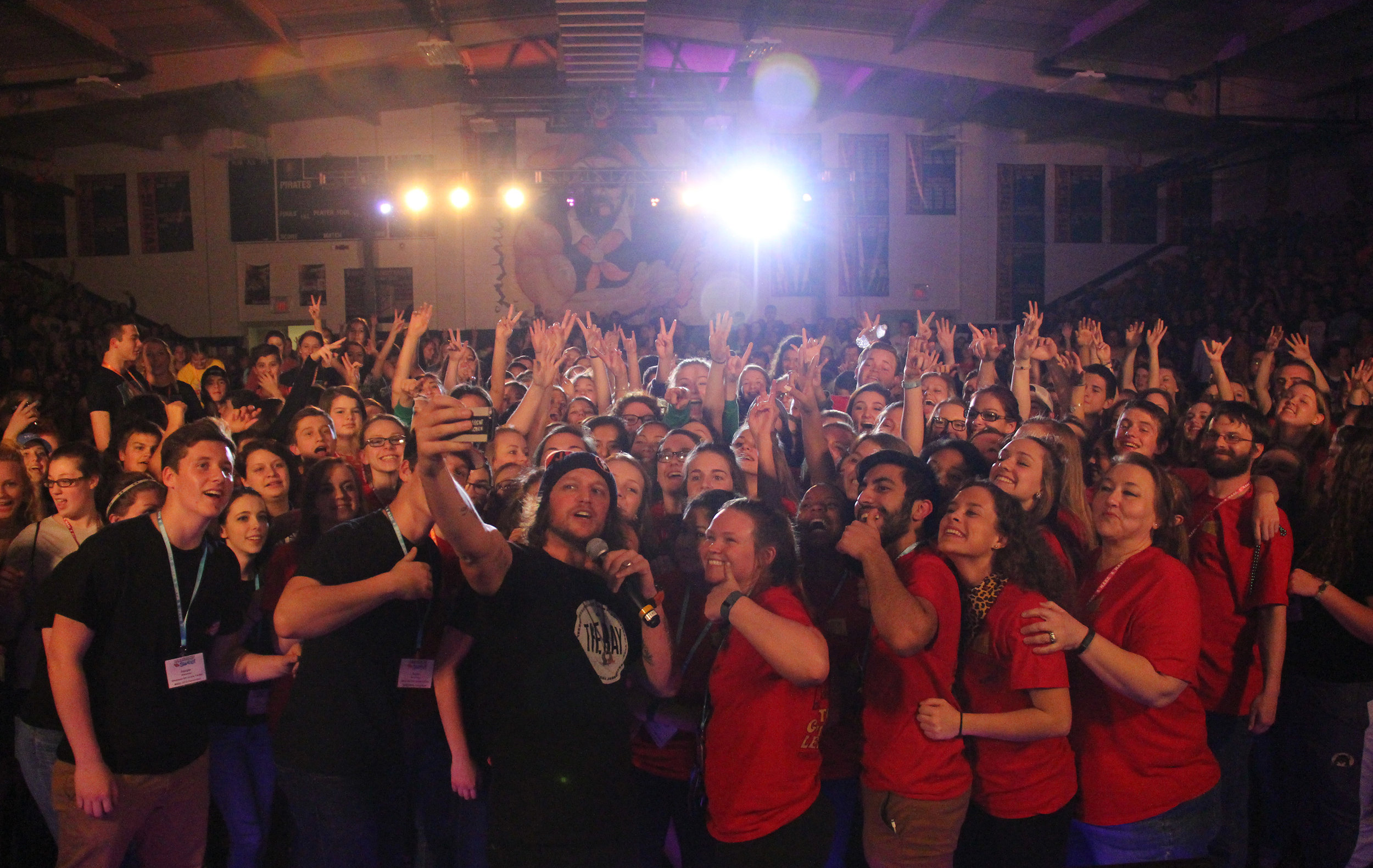 ROSS MARTIN/Citizen photo Motivational speaker Mike Smith, center, took a moment for a mass group selfie after he delivered the keynote speech during the opening ceremony of the Missouri Association of Student Councils annual convention held in March at Platte County High School.