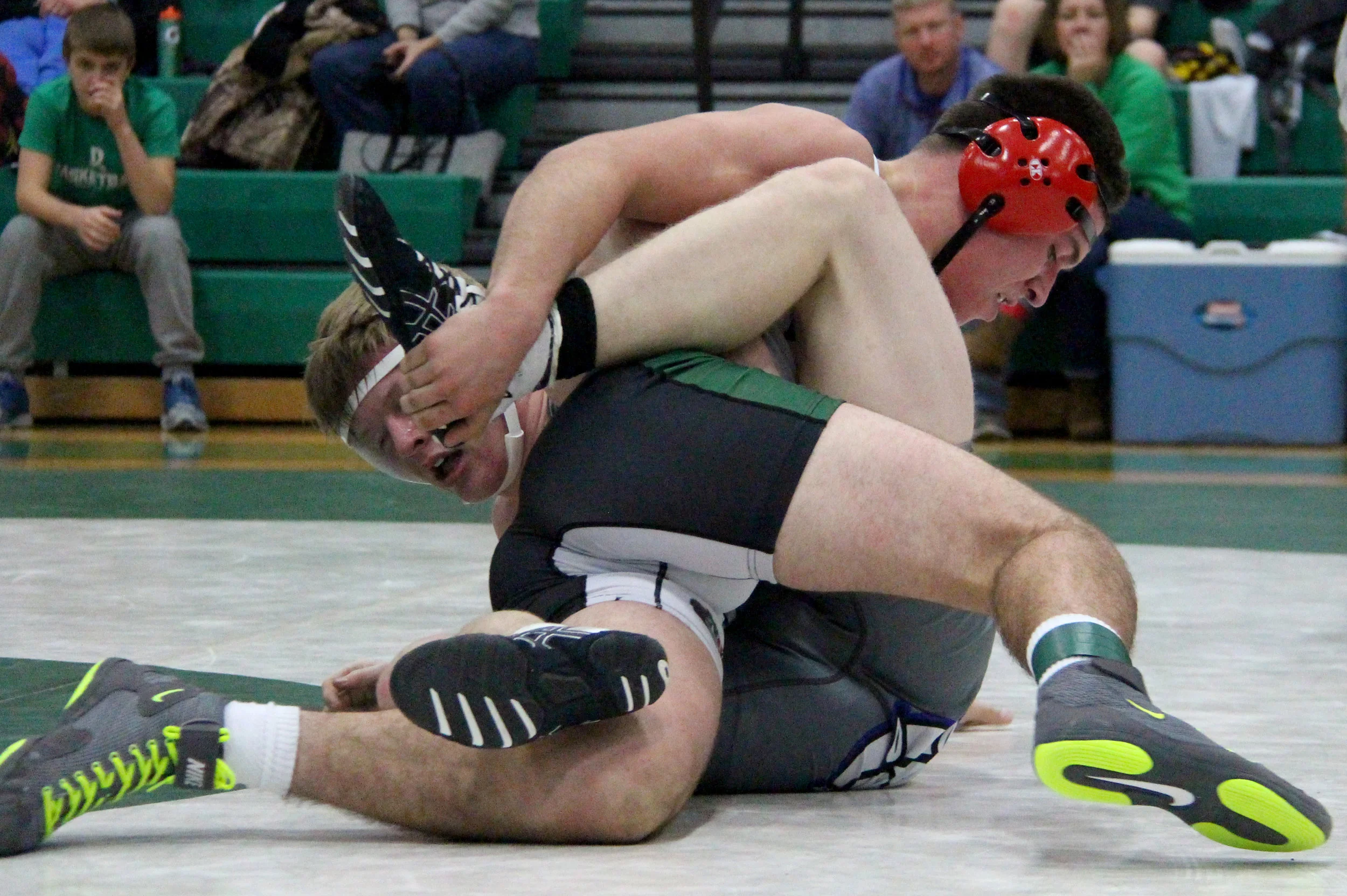 ROSS MARTIN/Citizen photo Mid-Buchanan’s Parker Rotterman, top, grapples with South Harrison’s Gavin Johns in a 160-pound semifinal in the Mid-Buchanan Invitational on Saturday, Jan. 7 in Faucett, Mo. 