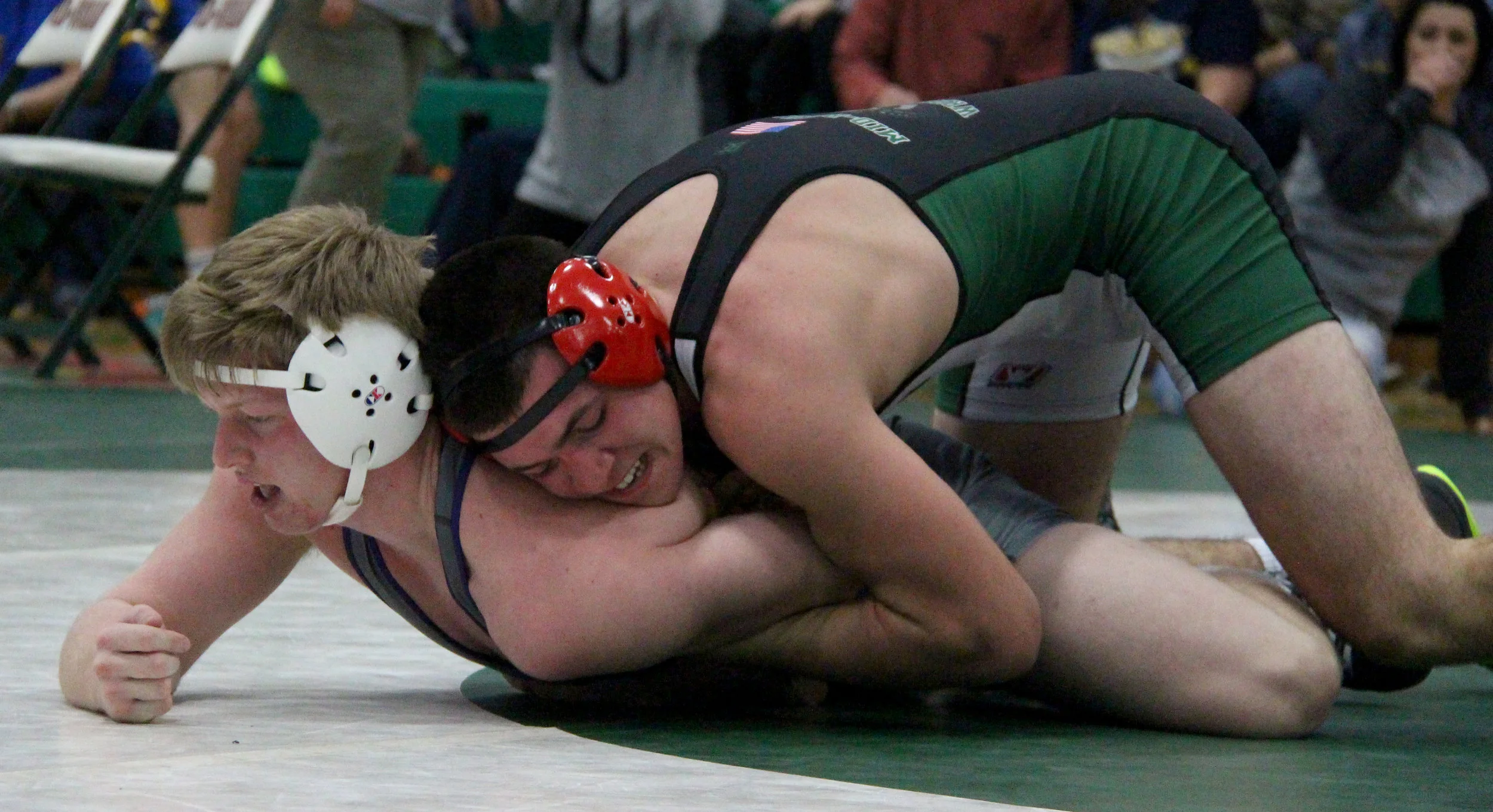 ROSS MARTIN/Citizen photo Mid-Buchanan’s Parker Rotterman, top, controls South Harrison’s Gavin Johns during their 160-pound semifinal match Saturday, Jan. 7 in the Mid-Buchanan Invitational at Mid-Buchanan High School in Faucett, Mo. 