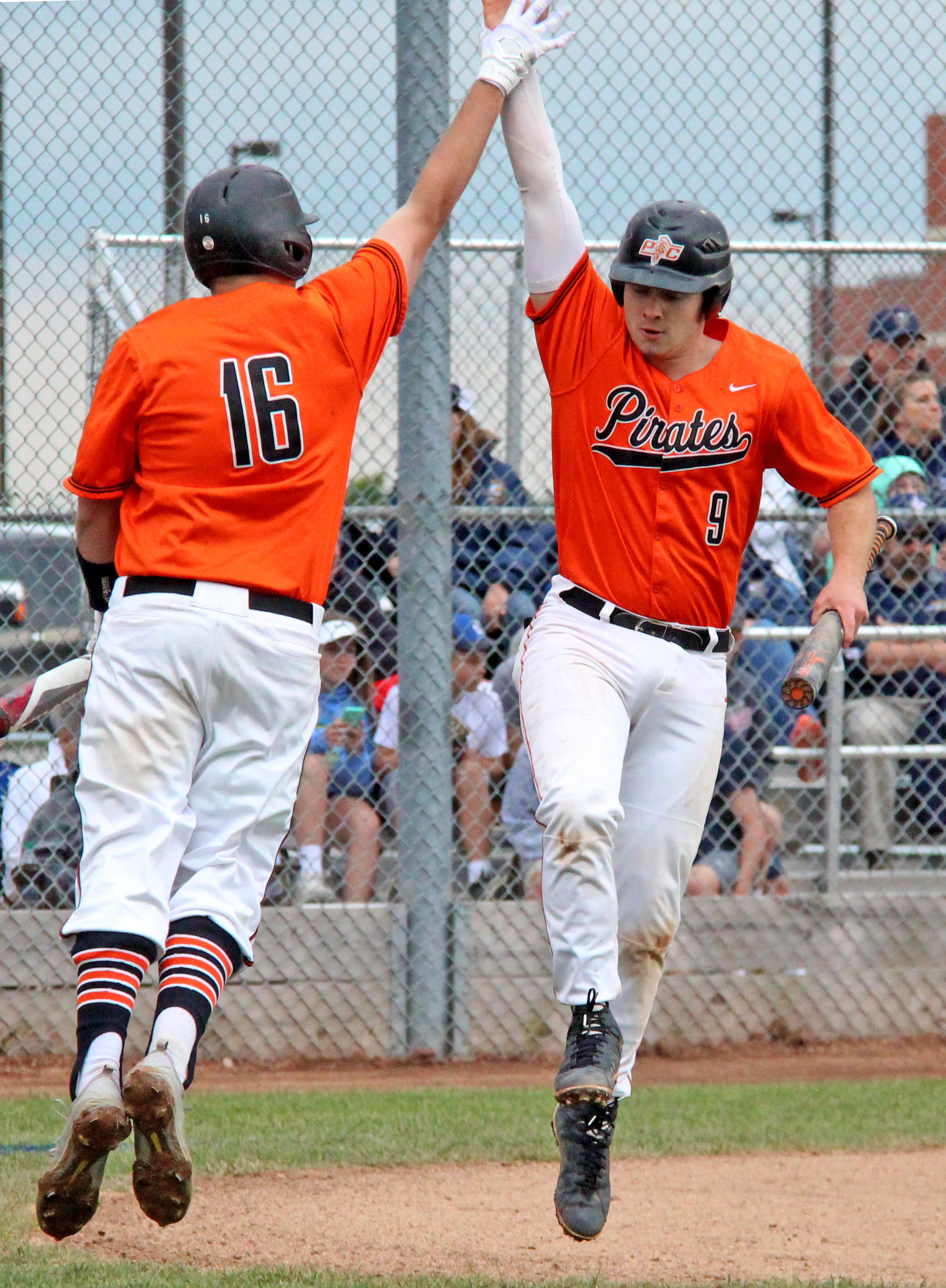 ROSS MARTIN/Citizen Editor Platte County seniors Justin Mitchell, right, and Austin Gammill celebrate Mitchell's first inning run in a Class 5 sectional against Liberty North on Tuesday, May 23 in Liberty, Mo.