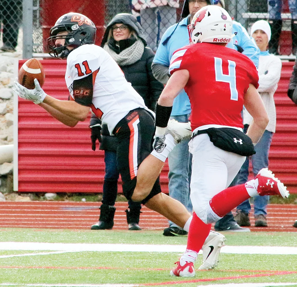 ROSS MARTIN/Citizen photos TOP: Platte County senior wide receiver Devin Richardson (11) makes a 44-yard diving reception in the second half of a Class 4 semifinal Saturday, Nov. 18 at Cardinal Stadium in Webb City, Mo. BOTTOM: Platte County senior kicker Parker Lacina (10) makes a 47-yard field goal for the Pirates during the third quarter.