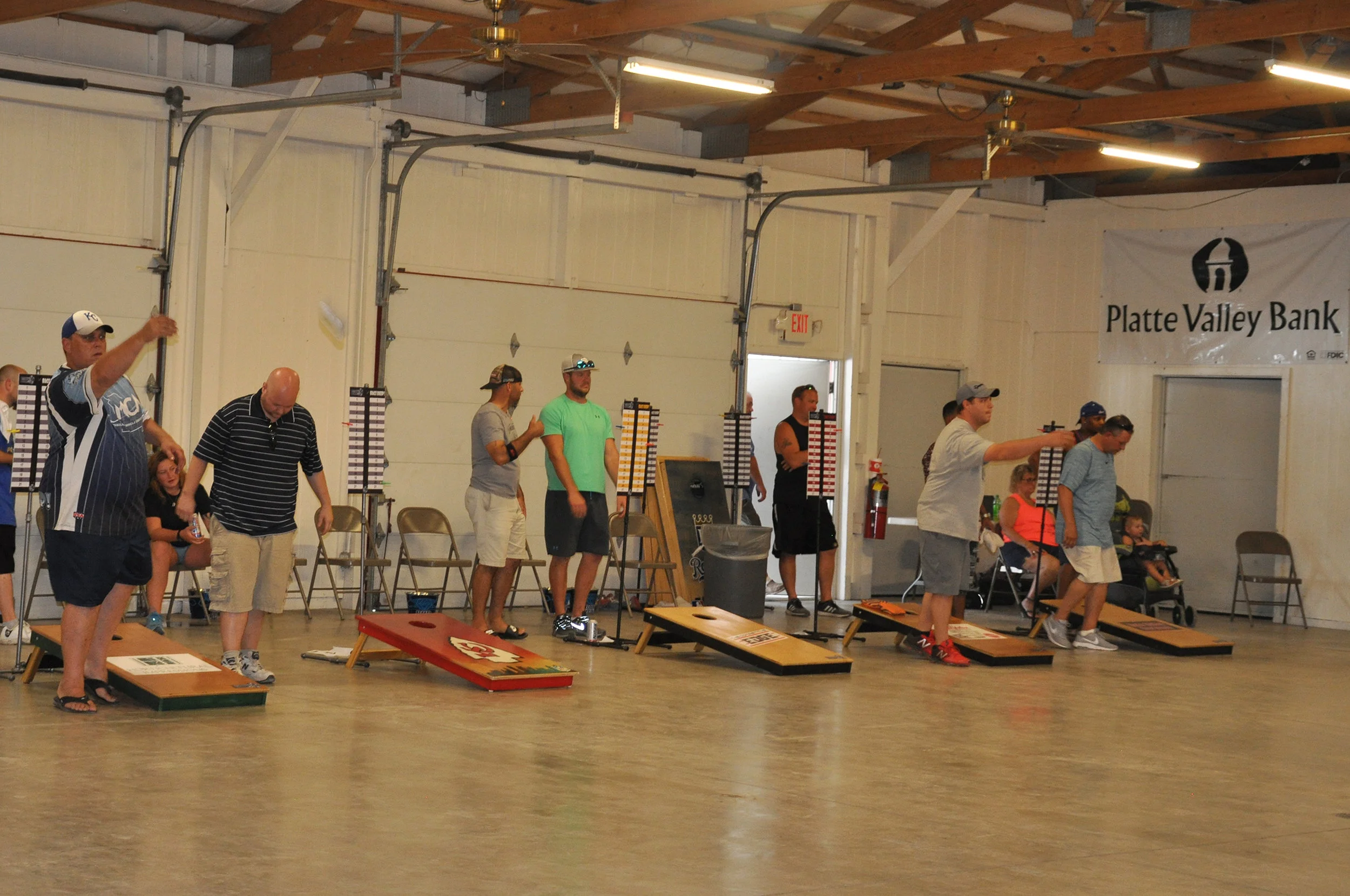 CYNTHIA CLARK/Special to the Citizen Mark Isley, far left, helped run the first-ever Platte County Fair Cornhole Tournament and competed in the event as well on Saturday, July 21, in the Platte Purchase Building in Tracy, Mo.