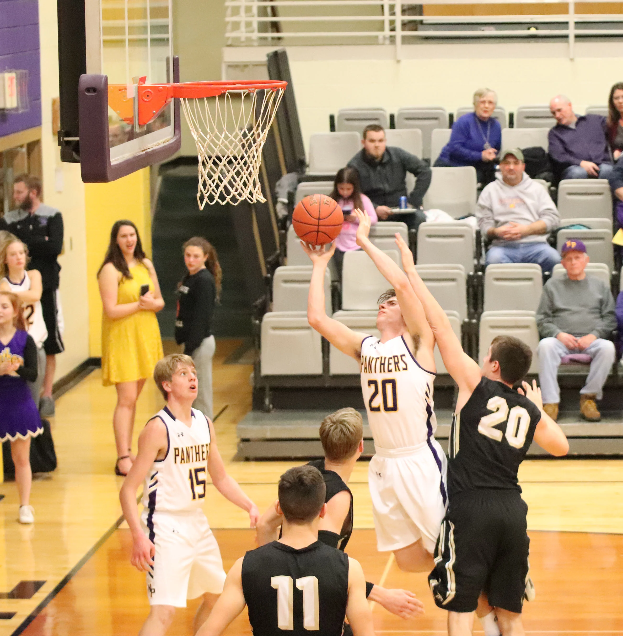 CODY THORN/Citizen photo North Platte’s Ty French, shooting, draws a foul by Lathrop’s Colton Nichols during the second half of a KCI Conference game on Thursday, Jan. 17 in Dearborn, Mo.