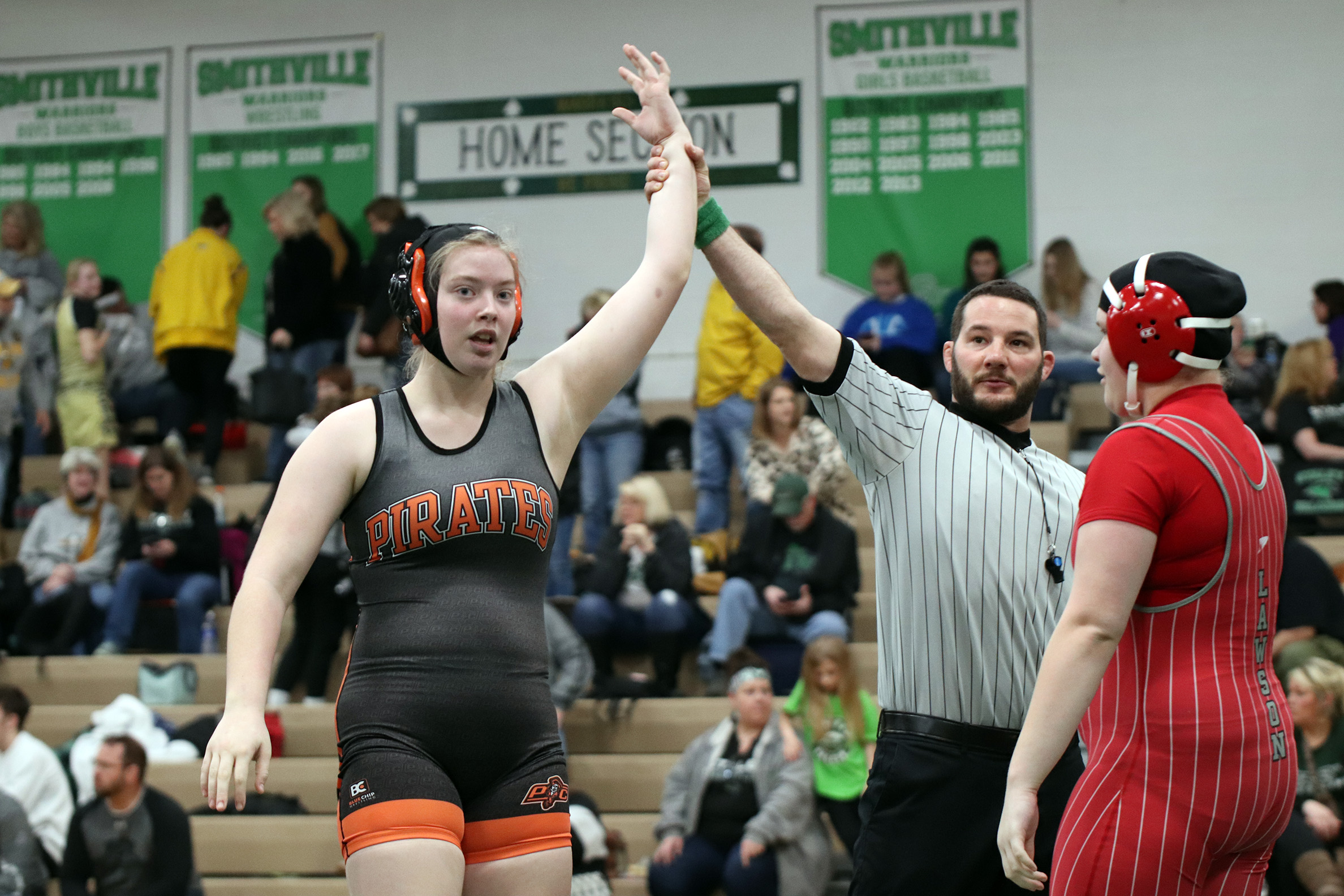 CODY THORN/Citizen photo Platte County’s KayLyn Munn, left, won the third-place match in the Class 1 District 4 tournament on Saturday, Feb. 2 at Smithville.