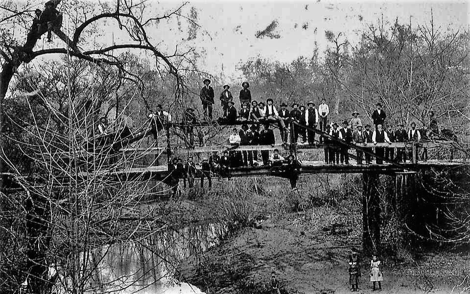 Contributed photo This undated photo shows the bridge - along with many of the residents of the town — not long after its construction. Trustees are searching for other historical information and artifacts to document Iatan’s history.
