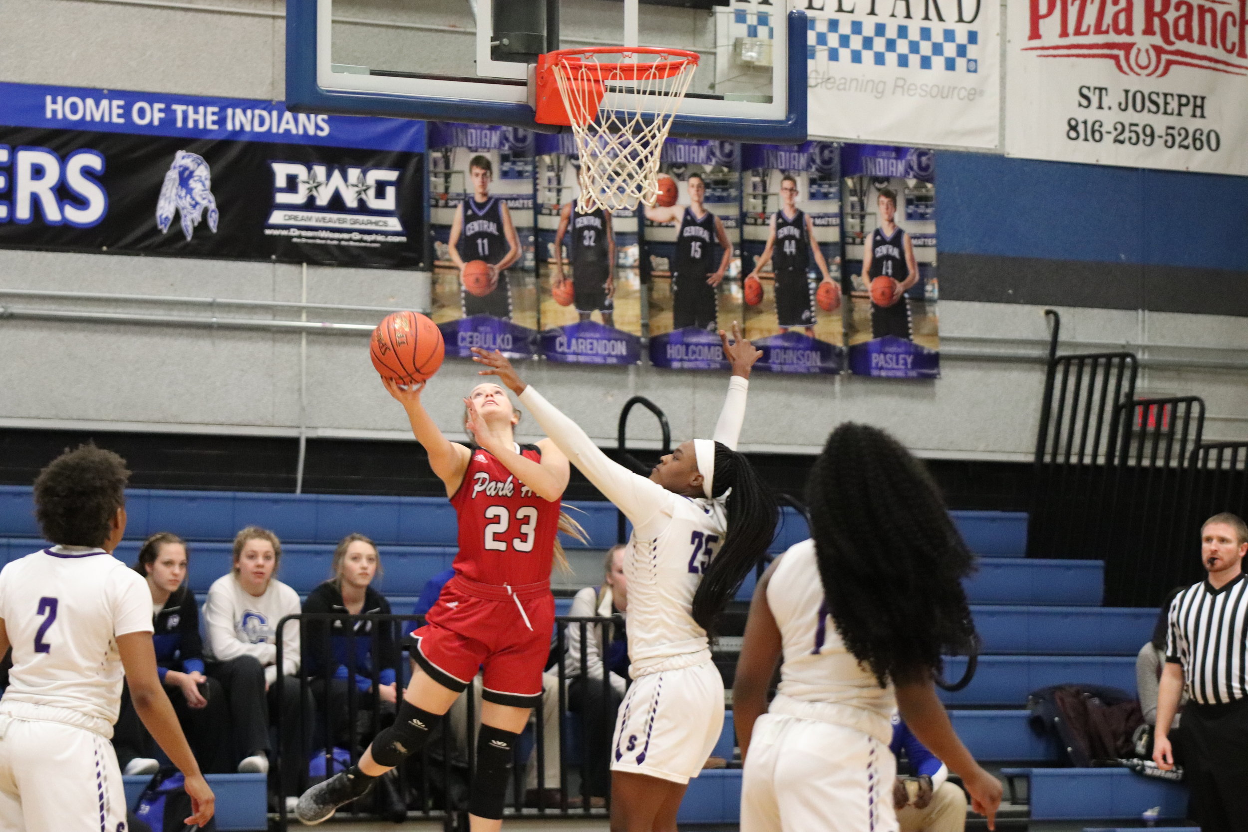 CODY THORN/Citizen photo Park Hill’s Hannah Graves, left, goes up for layup while being defended by Park Hill South’s Alecia Westbrook during a Class 5 District 16 game on Monday, Feb. 25 in Central High School in St. Joseph.