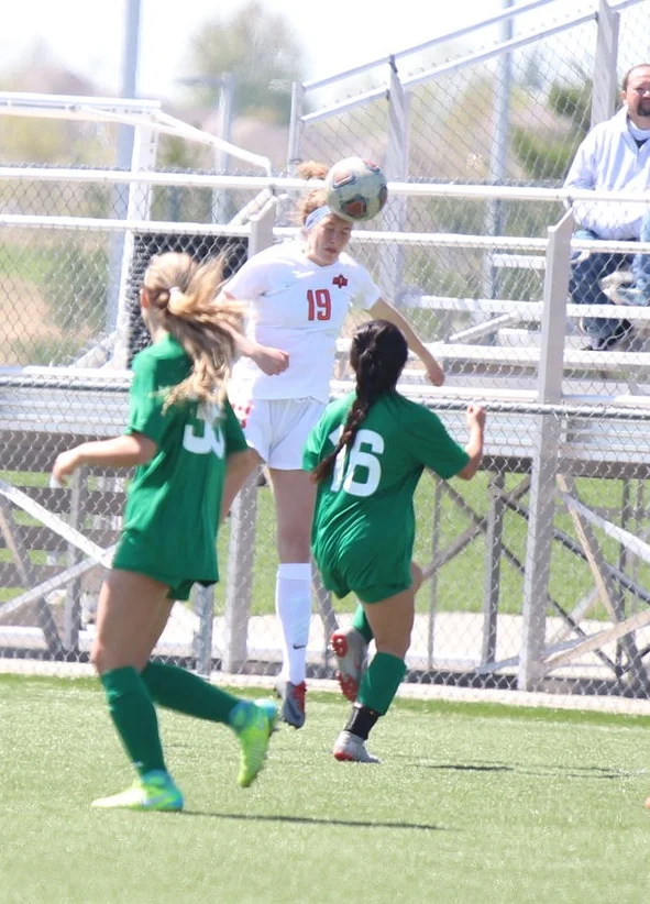 Platte County’s Nicolas Kingery, center, heads the ball near two Smithville defenders in the second half of Saturday’s title game that the Pirates won 1-0.