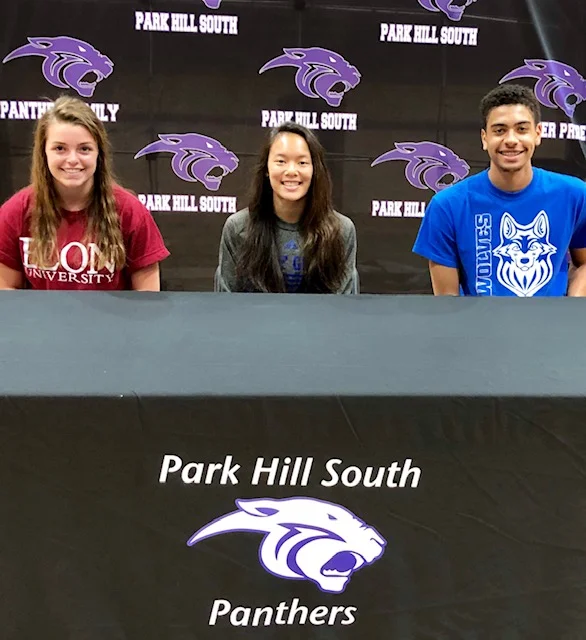 Submitted photo Park Hill South students from left to right, Grace Dieleman, Taylor Young and Anthony Bell, signed to compete in various sports at the next level. Dieleman will throw javelin at Elon. Young will attend the U.S. Coast Guard Academy and be part of the diving team. Bell will play basketball at Metropolitan Community College.