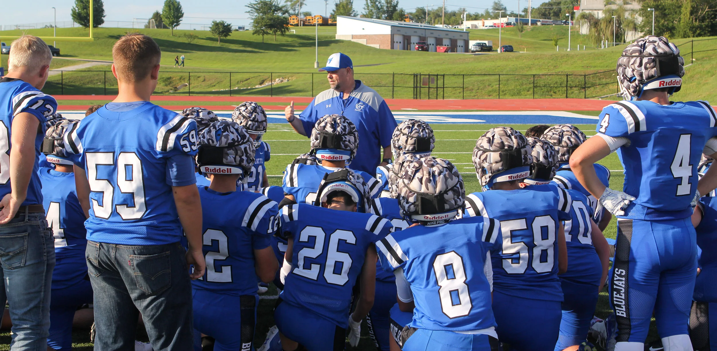 SCOTT ENGLERT/Special to the Citizen Paul Thomas talks with his team after the jamboree on Friday, Aug. 23 at Rudolph Eskridge Stadium in Weston.