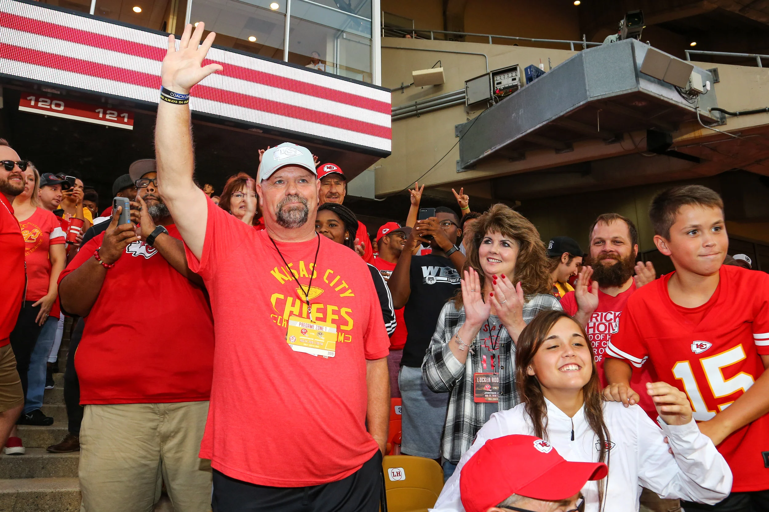 STEVE SANDERS/KANSAS CITY CHIEFS West Platte football coach Paul Thomas waves to the crowd after being recognized during the Kansas City Chiefs game on Saturday, Aug. 24 against the San Francisco 49ers. Thomas was sitting in the Lamar Hunt Legacy Seats, being honored for his role in high school football in Missouri and taking over West Platte’s squad three years ago.