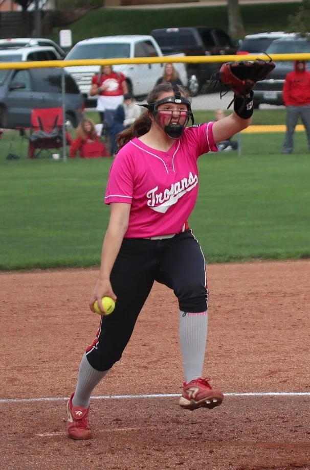 CODY THORN/Citizen photo Park Hill’s Kaylyn Jones delivers a pitch during Thursday’s game at Park Hill High School. The Trojans debuted new uniforms to honor a former player.