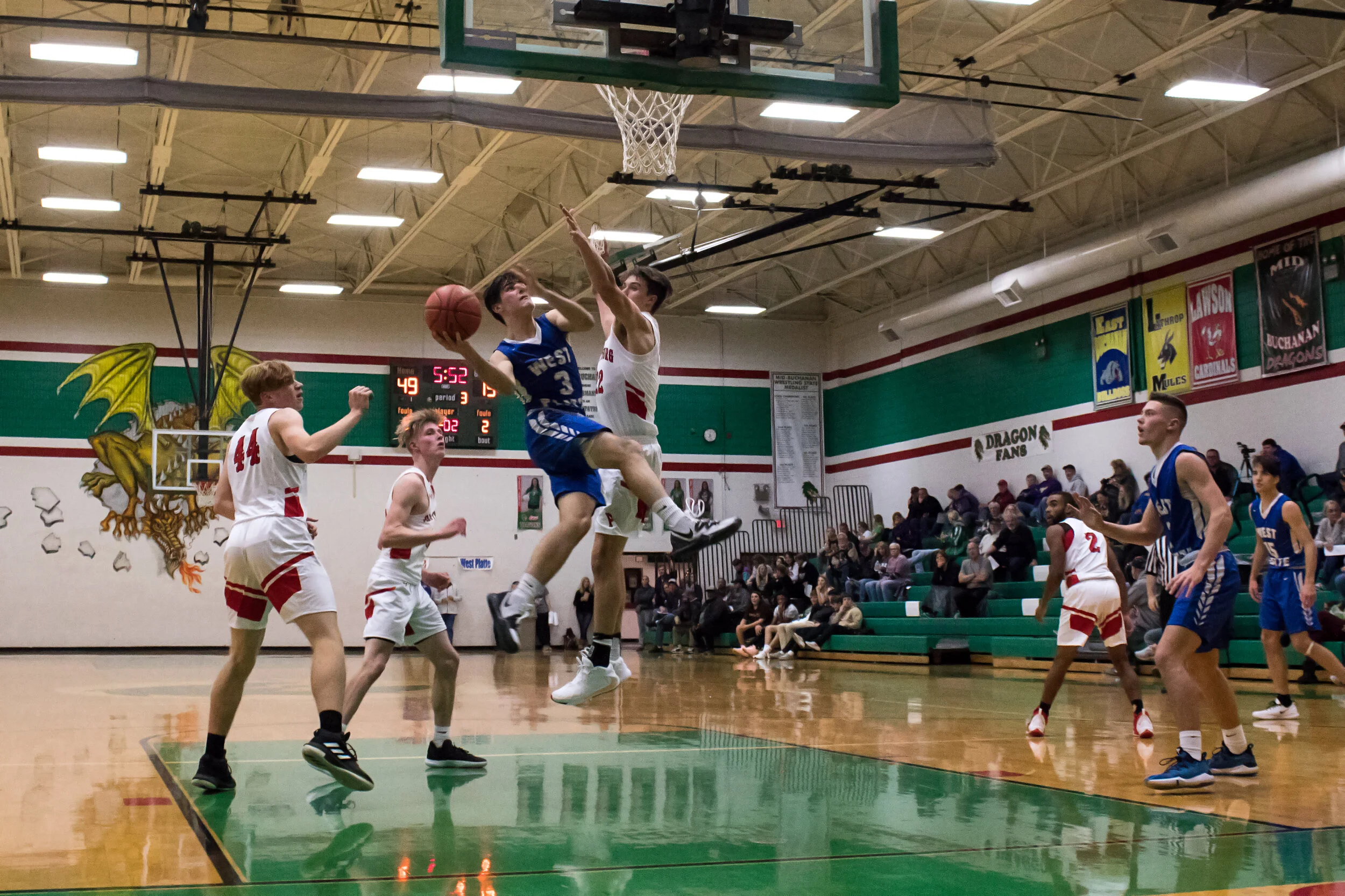 G1 Brayden Cogan (3) fights through the defense for a layup.jpg