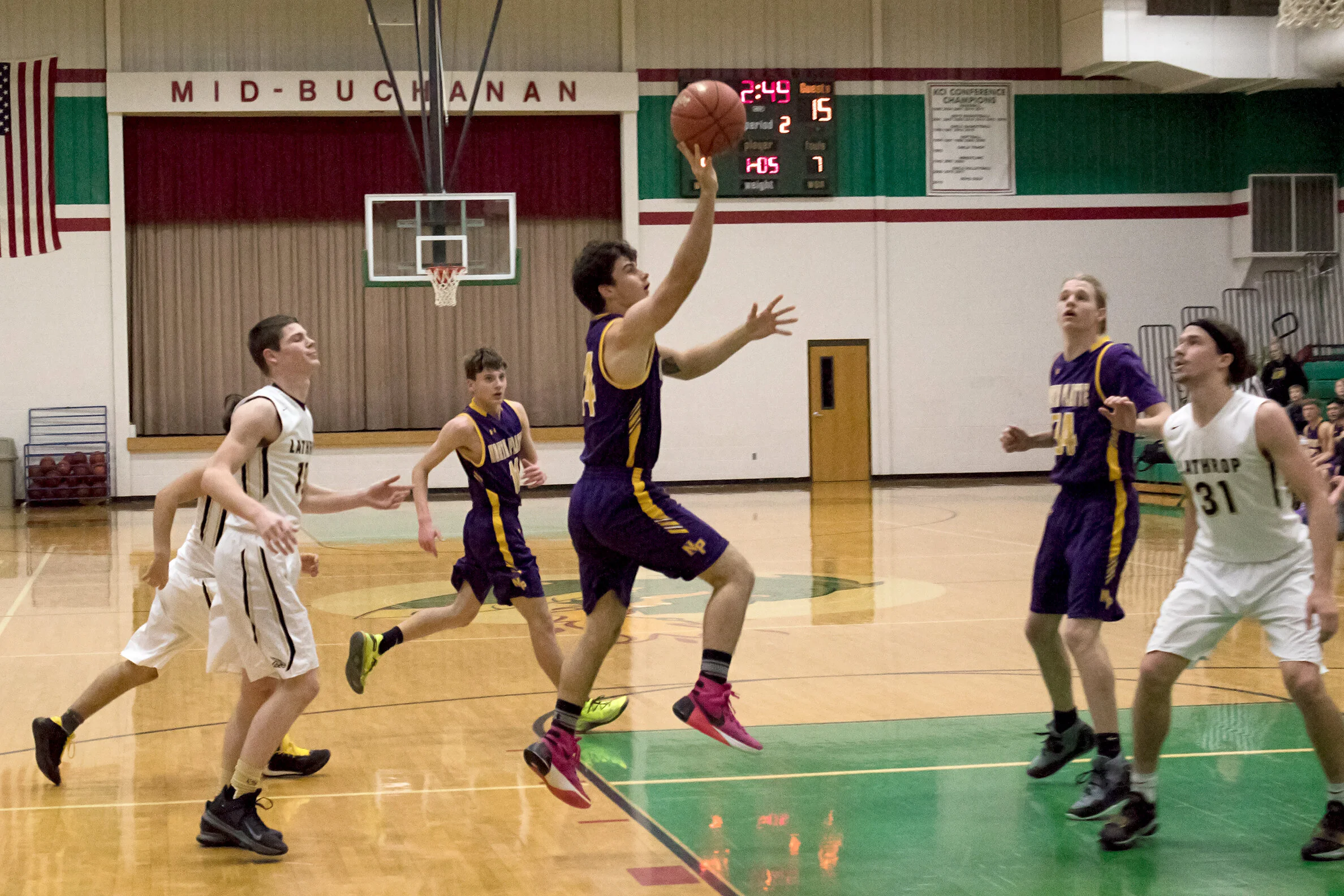 G2 Joel Smyser (with ball) slips by his defender and puts up a floater.jpg