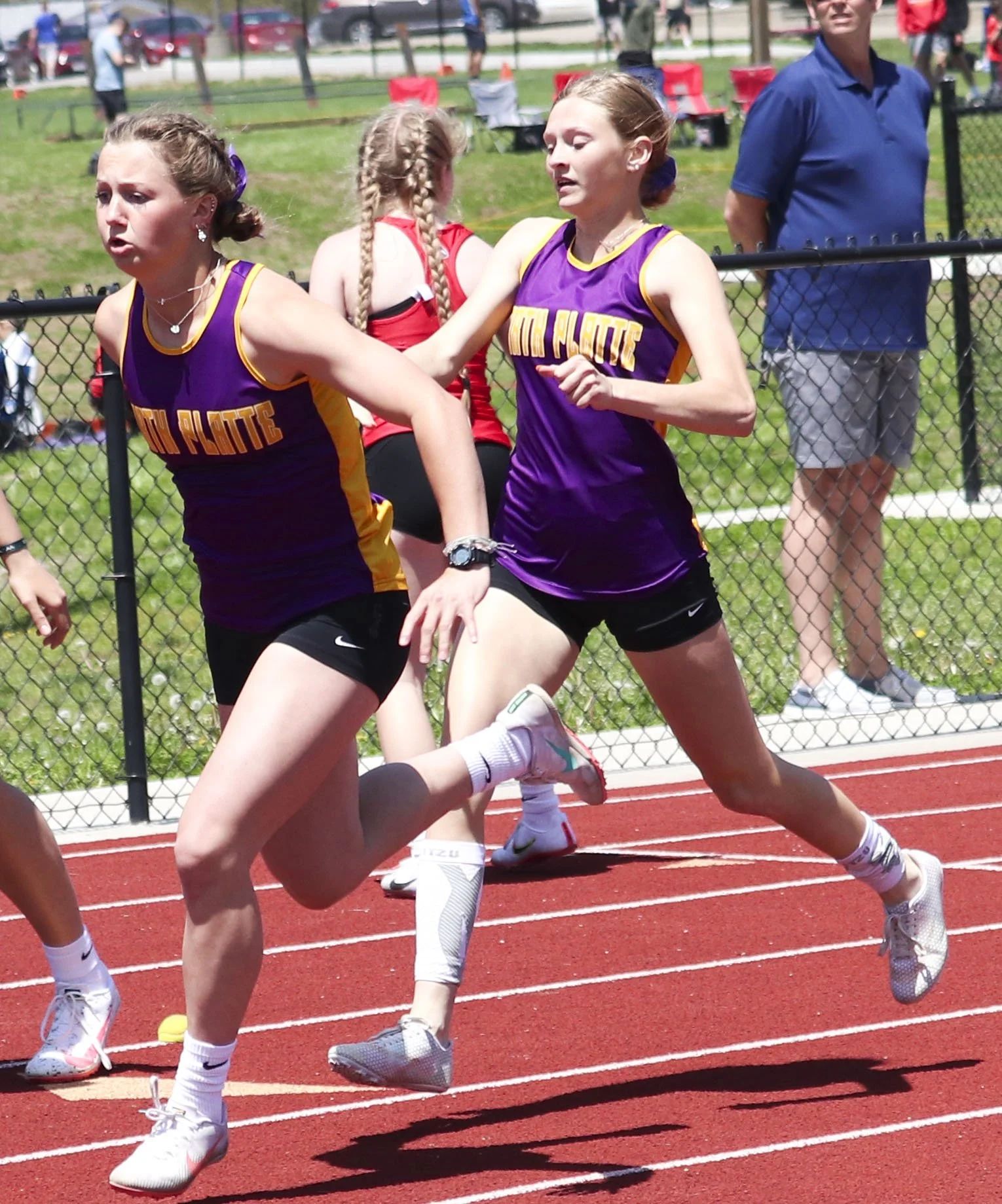NP girls second 4x200 handoff_1.jpg